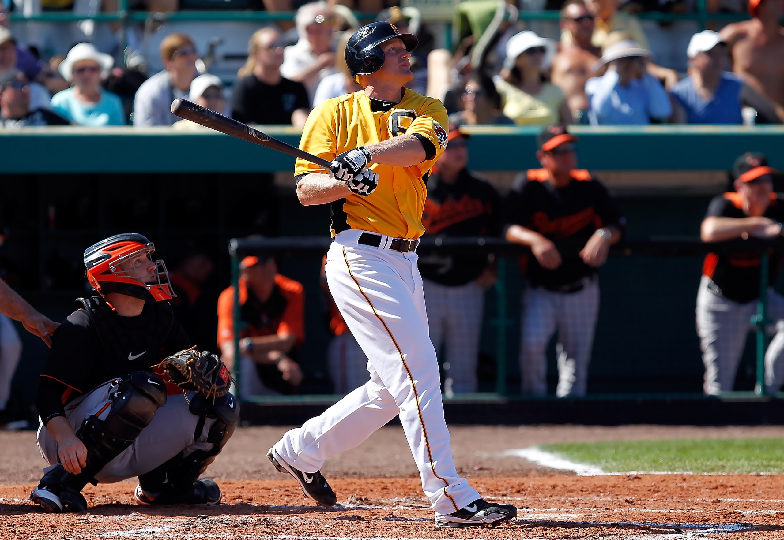 BRADENTON, FL - FEBRUARY 28:  First baseman Lyle Overbay #37 of the Pittsburgh Pirates watches his home run as catcher Craig Tatum #15 of the Baltimore Orioles looks on during a Grapefruit League Spring Training Game at McKechnie Field on February 28, 201