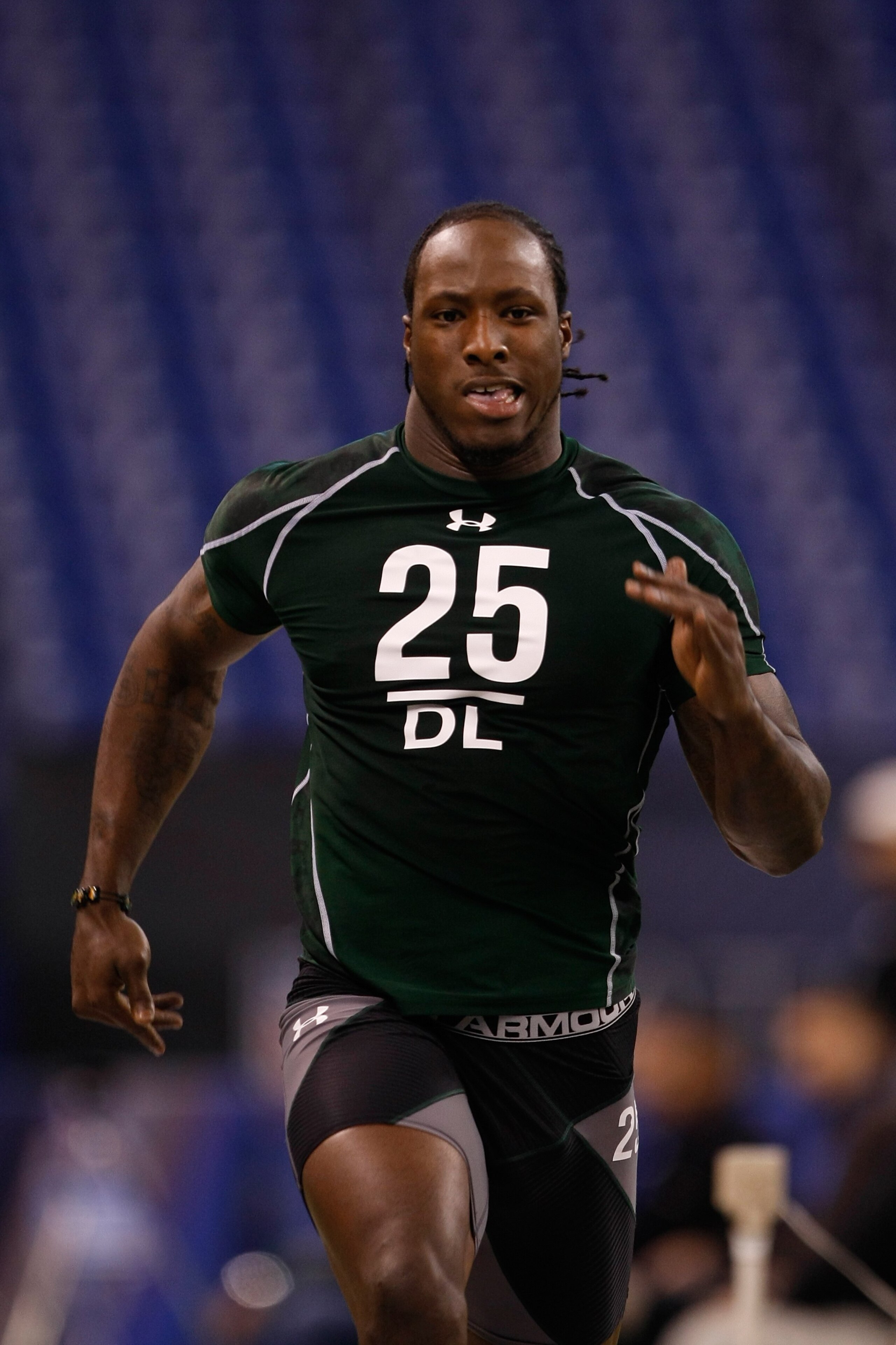 INDIANAPOLIS, IN - MARCH 1: Defensive lineman Sergio Kindle of Texas runs the 40 yard dash during the NFL Scouting Combine presented by Under Armour at Lucas Oil Stadium on March 1, 2010 in Indianapolis, Indiana. (Photo by Scott Boehm/Getty Images)