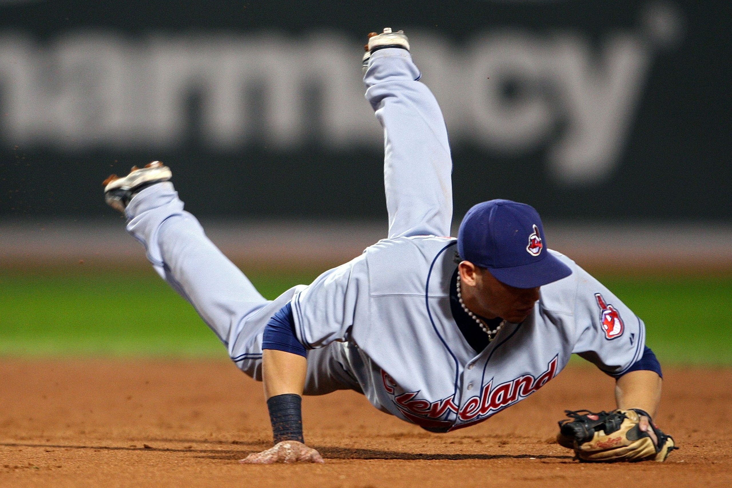 BOSTON - OCTOBER 21: Asdrubal Cabrera #13 of the Cleveland Indians dives for but fail to catch a grounder hit by Julio Lugo #23 of the Boston Red Sox during Game Seven of the American League Championship Series at Fenway Park on October 21, 2007 in Bosto BOSTON - OCTOBER 21: Asdrubal Cabrera #13 of the Cleveland Indians dives for but fail to catch a grounder hit by Julio Lugo #23 of the Boston Red Sox during Game Seven of the American League Championship Series at Fenway Park on October 21, 2007 in Bosto