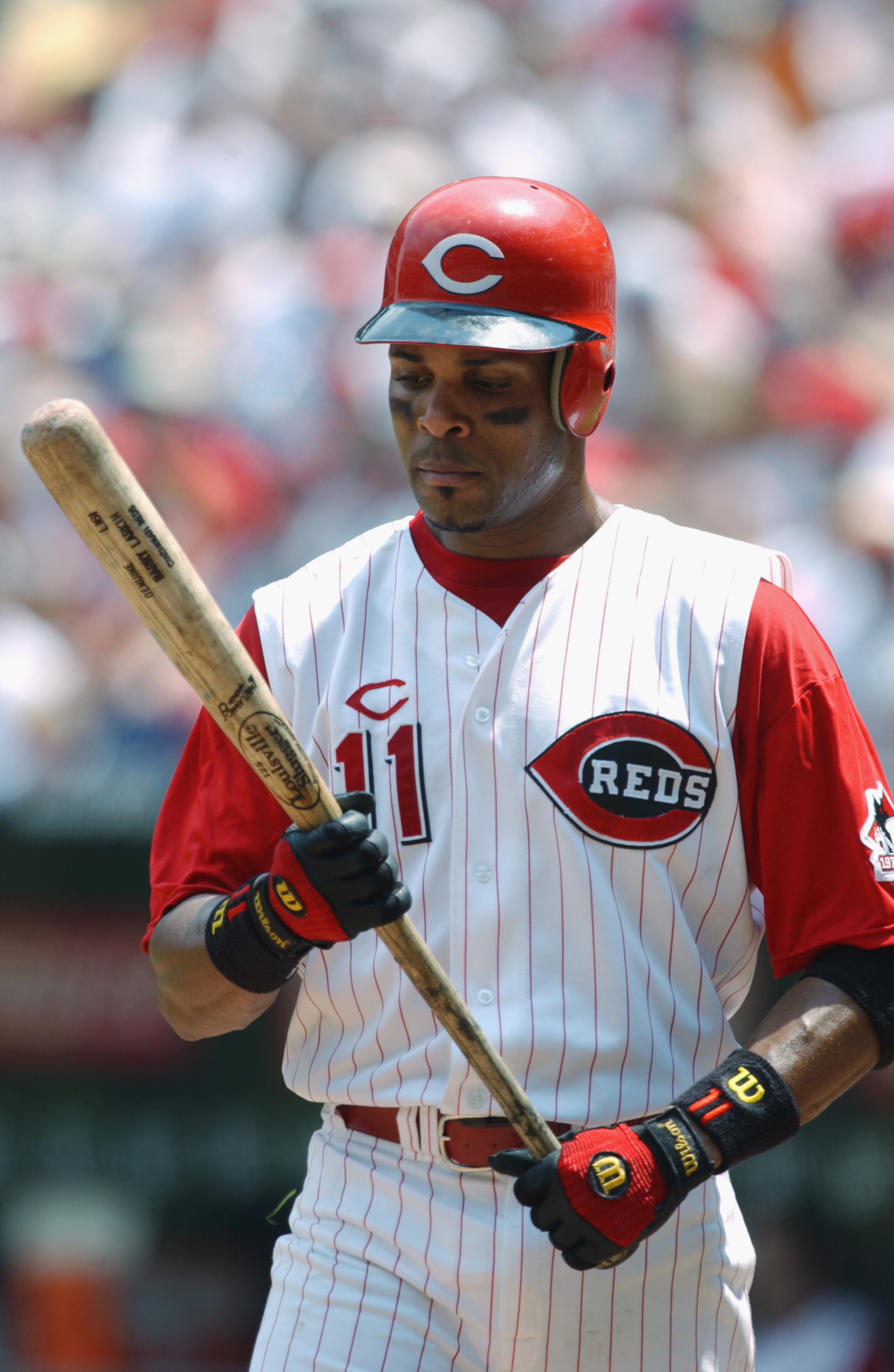 CINCINNATI - JULY 21:  Shortstop Barry Larkin #11 of the Cincinnati Reds examines his bat during the MLB game against the New York Mets on July 21, 2002  at Cinergy Field in Cincinnati, Ohio.  The Reds defeated the Mets 9-1. (Photo By Matthew Stockman/Get