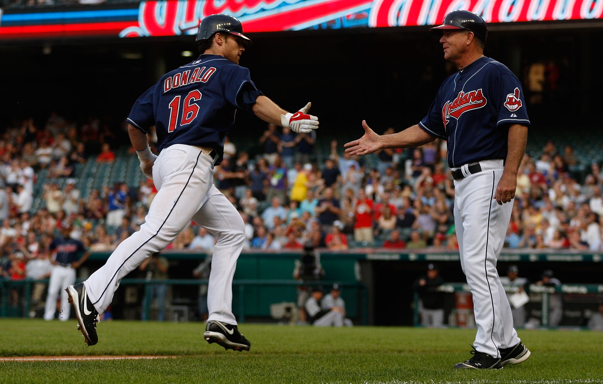 CLEVELAND - MAY 25: Jason Donald #16 of the Cleveland Indians is congratulated while rounding third base by Steve Smith #10 after hitting a home run against the Chicago White Sox during the game on May 25, 2010 at Progressive Field in Cleveland, Ohio. ( CLEVELAND - MAY 25: Jason Donald #16 of the Cleveland Indians is congratulated while rounding third base by Steve Smith #10 after hitting a home run against the Chicago White Sox during the game on May 25, 2010 at Progressive Field in Cleveland, Ohio. (