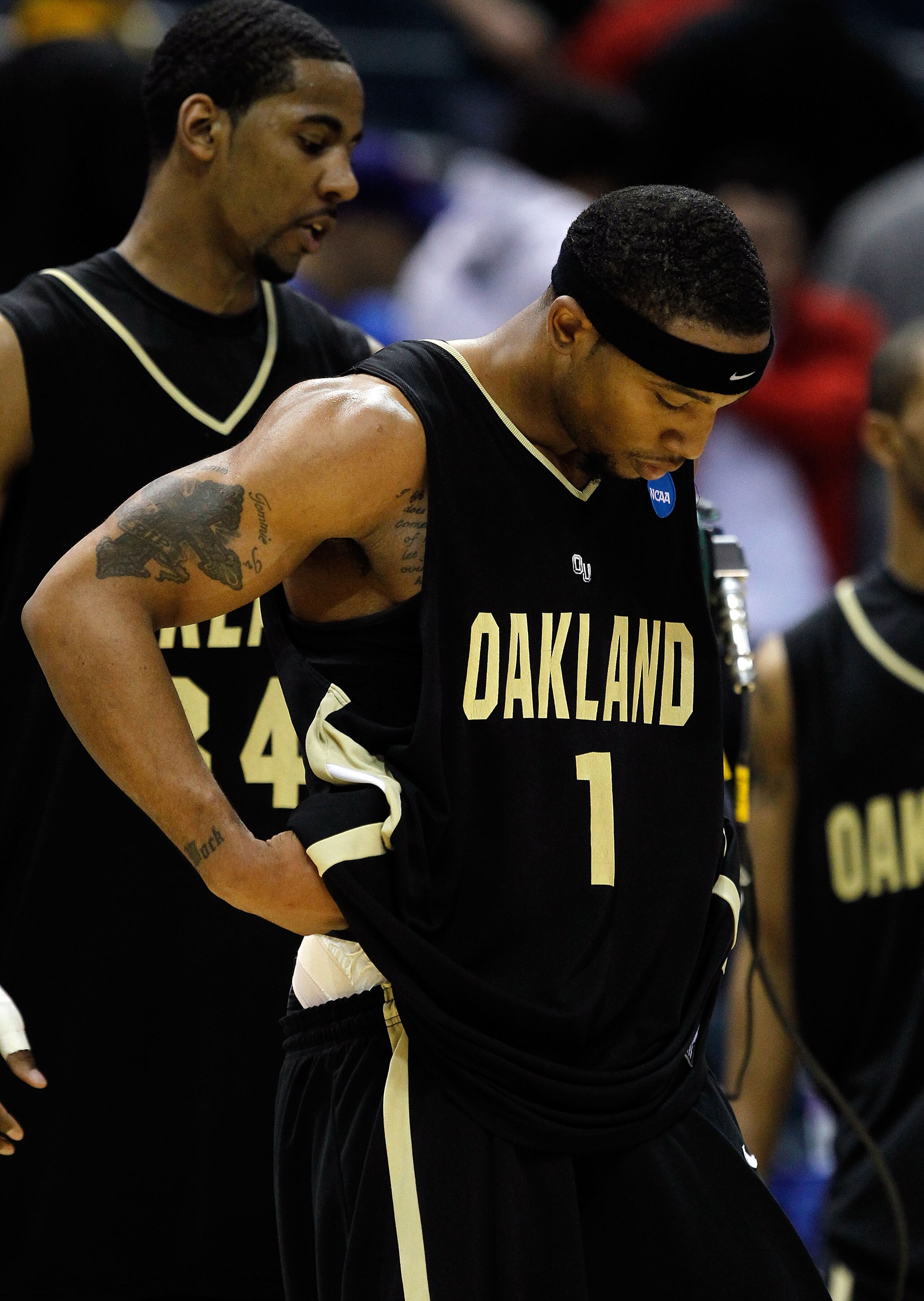 MILWAUKEE - MARCH 19:  Derick Nelson #1 and Keith Benson #34 of the Oakland Golden Grizzlies looks down after losing to the Pittsburgh Panthers 89-66 during the first round of the 2010 NCAA men's basketball tournament at the Bradley Center on March 19, 20