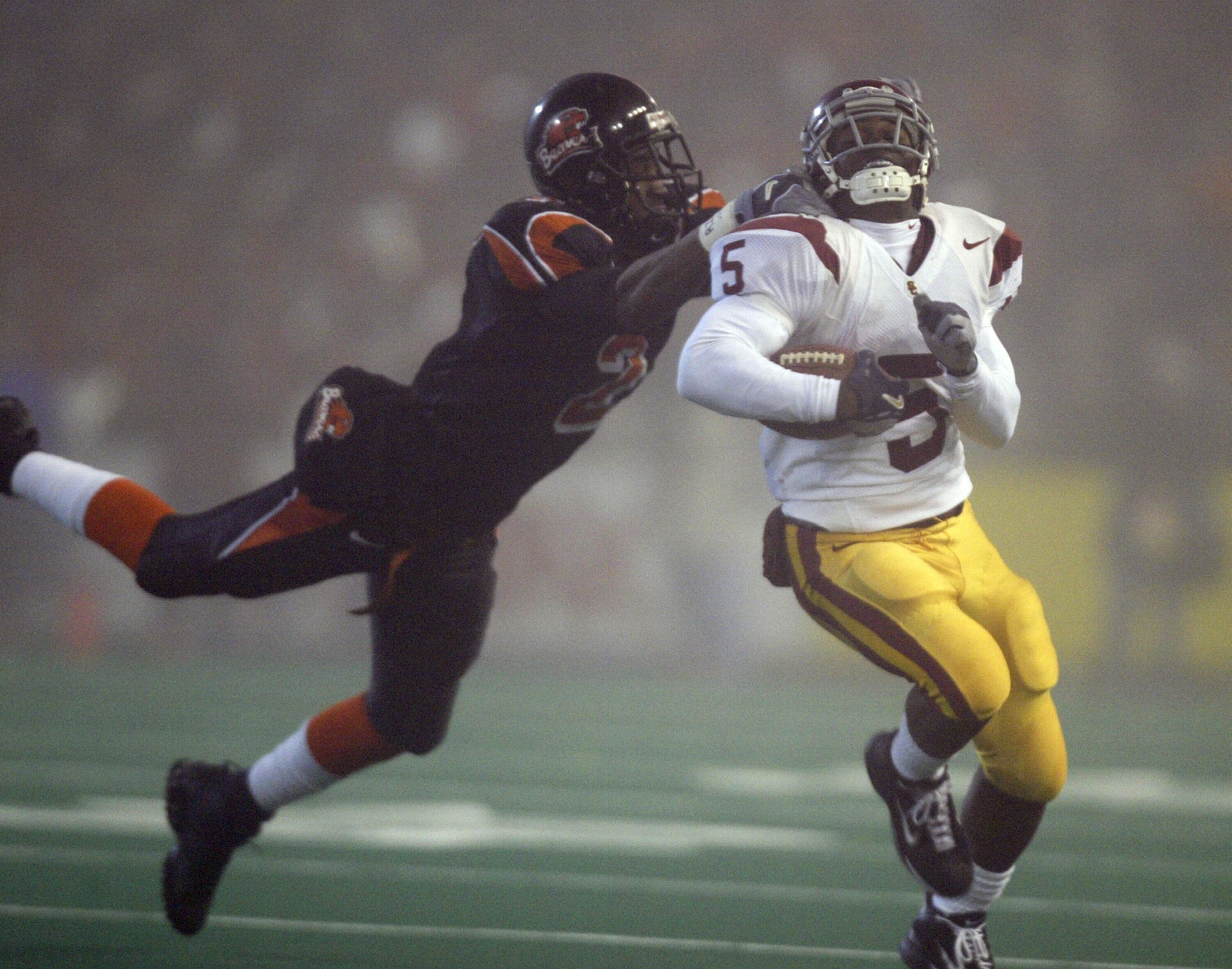 CORVALLIS, OR - NOVEMBER 6: Running back Reggie Bush #5 of the USC Trojans rushes against Brandon Browner #2 of the Oregon State Beavers on November 6, 2004 at Reser Stadium in Corvallis, Oregon. (Photo by Otto Greule Jr/Getty Images) CORVALLIS, OR - NOVEMBER 6: Running back Reggie Bush #5 of the USC Trojans rushes against Brandon Browner #2 of the Oregon State Beavers on November 6, 2004 at Reser Stadium in Corvallis, Oregon. (Photo by Otto Greule Jr/Getty Images)