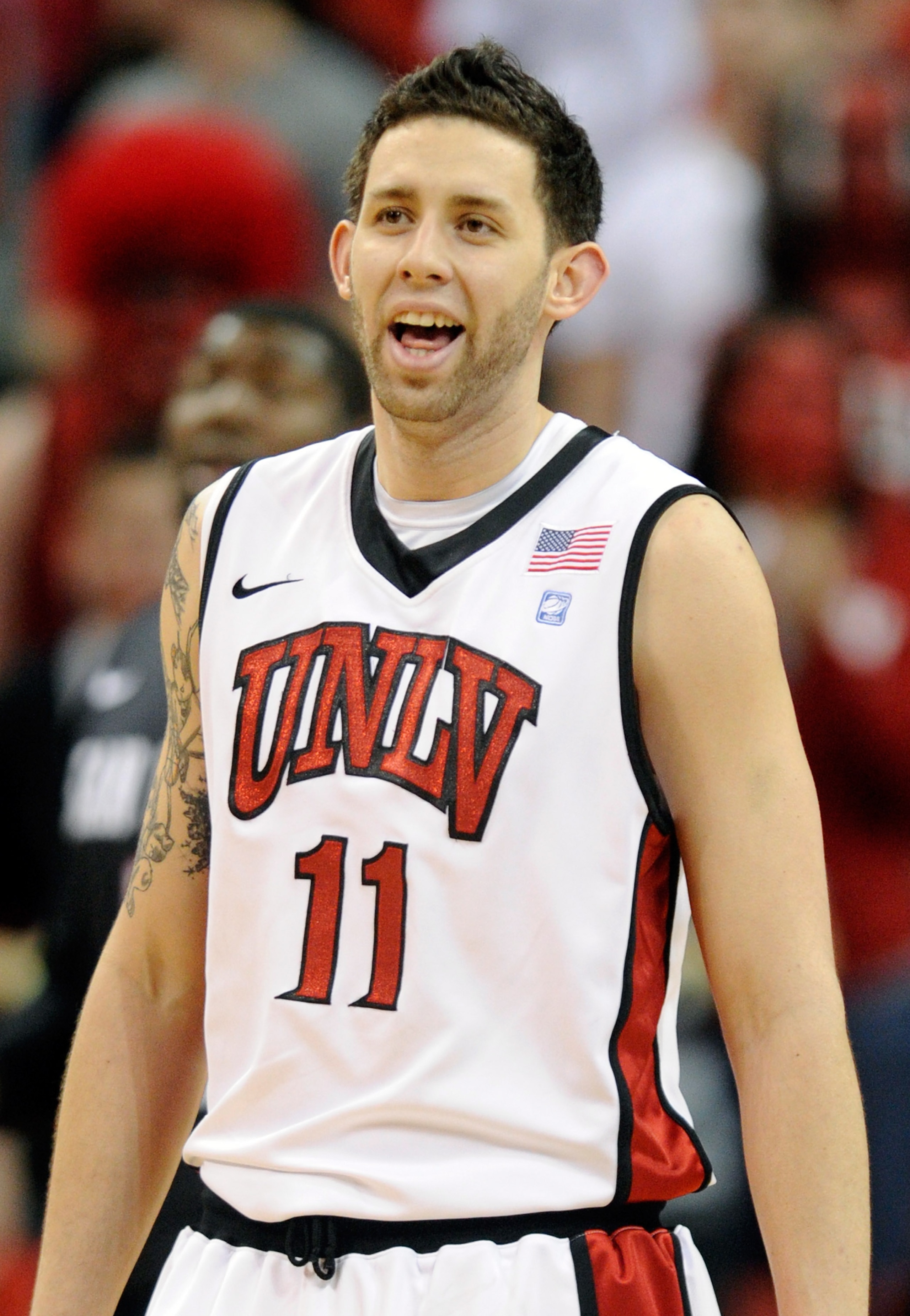 LAS VEGAS, NV - FEBRUARY 12:  Carlos Lopez #11 of the UNLV Rebels smiles on the court during a game against the San Diego State Aztecs at the Thomas & Mack Center February 12, 2011 in Las Vegas, Nevada. San Diego State won 63-57.  (Photo by Ethan Miller/G