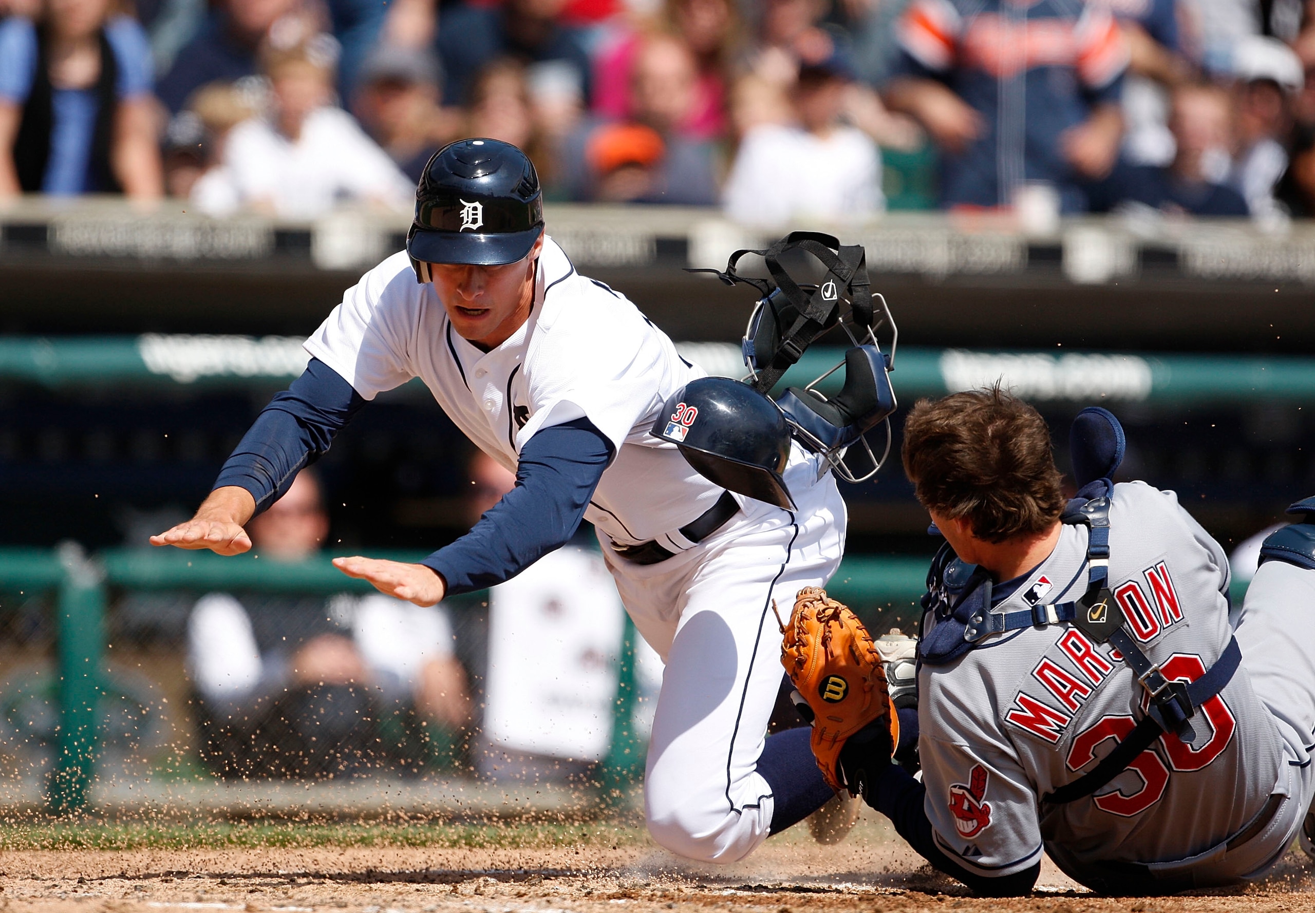 DETROIT - APRIL 11: Lou Marson #30 of the Cleveland Indians tags out Don Kelly #32 of the Detroit Tigers at home plate in the third inning during the game on April 11, 2010 at Comerica Park in Detroit, Michigan. (Photo by Leon Halip/Getty Images) DETROIT - APRIL 11: Lou Marson #30 of the Cleveland Indians tags out Don Kelly #32 of the Detroit Tigers at home plate in the third inning during the game on April 11, 2010 at Comerica Park in Detroit, Michigan. (Photo by Leon Halip/Getty Images)