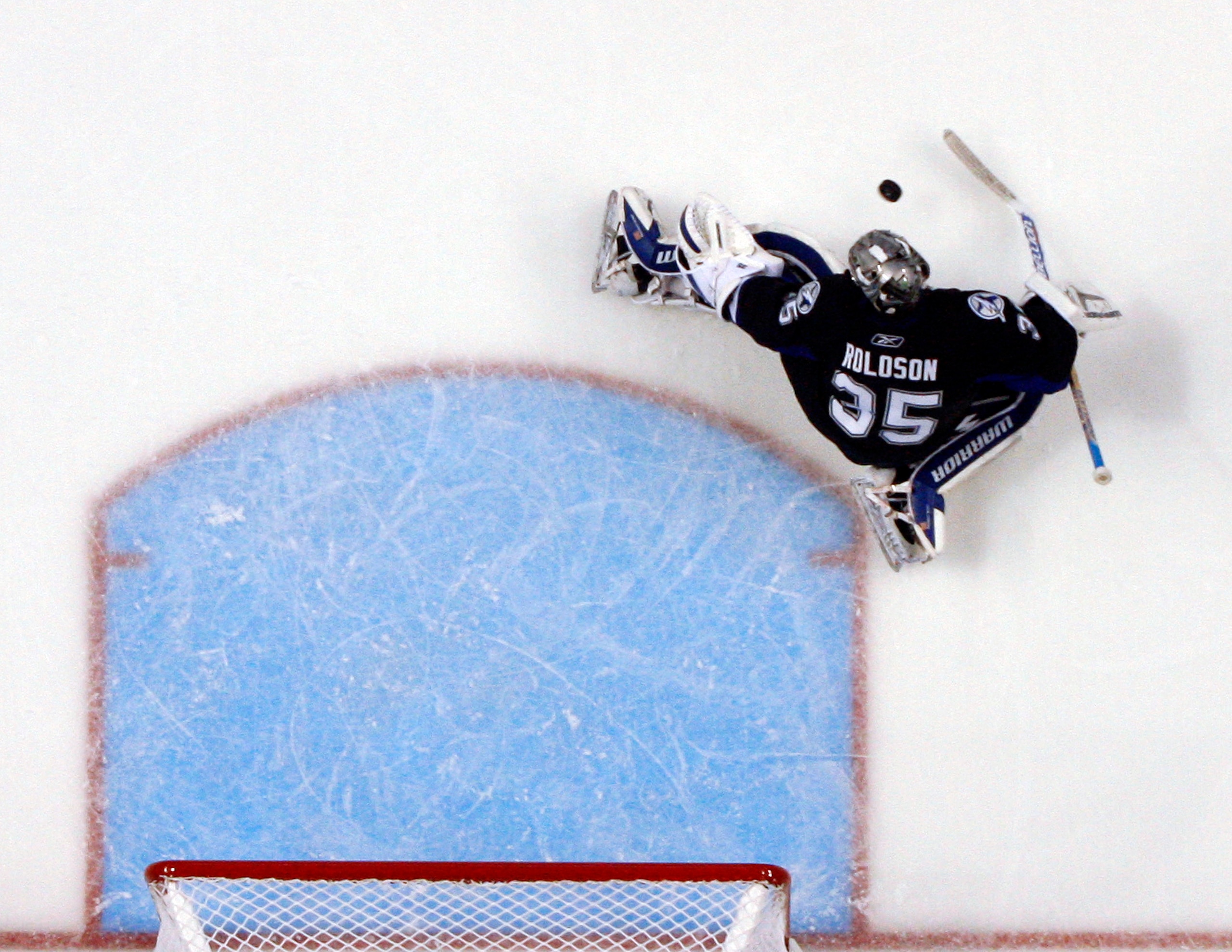 TAMPA, FL - JANUARY 25: Dwayne Roloson #35 of the Tampa Bay Lightning makes a save against the Toronto Maple Leafs at St. Pete Times Forum on January 25, 2011 in Tampa, Florida. The Lightning defeated the Leafs 2-0. (Photo by Justin K. Aller/Getty Images)