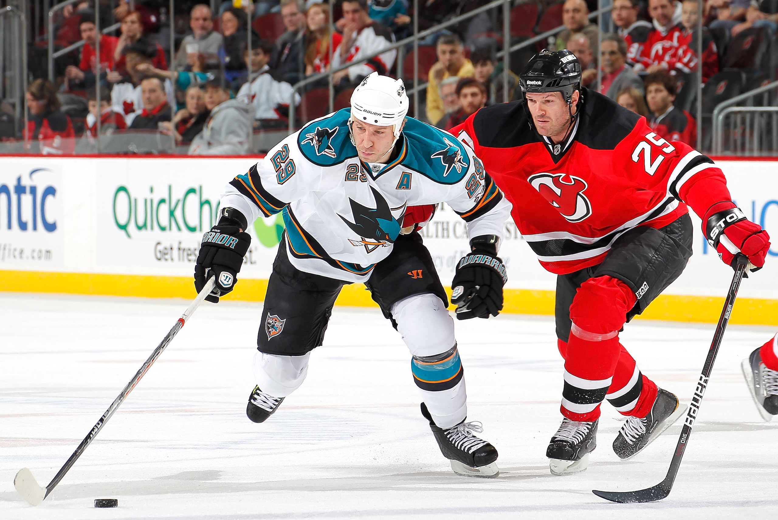 NEWARK, NJ - FEBRUARY 11: Ryane Clowe #29 of the San Jose Sharks skates away from Jason Arnott #25 of the New Jersey Devils during the first period of an NHL hockey game on February 11, 2011 at the Prudential Center in Newark, New Jersey. (Photo by Paul B