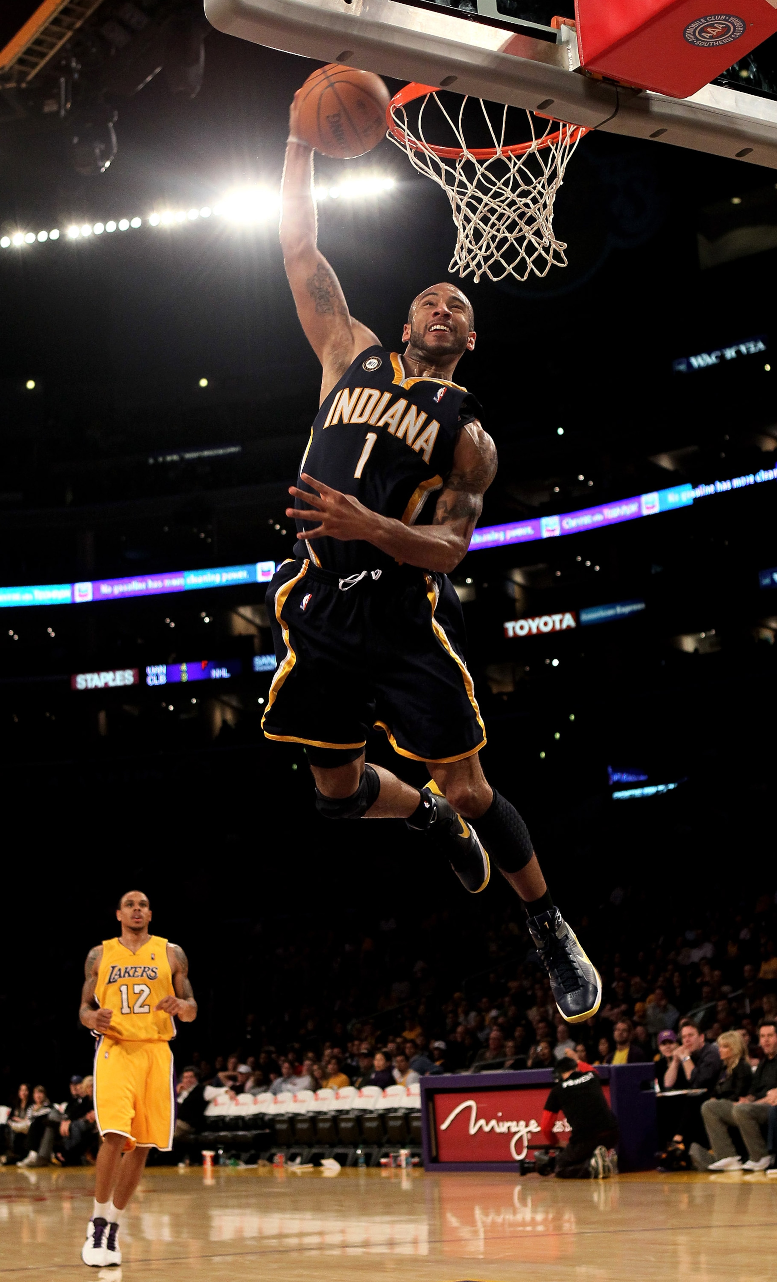 LOS ANGELES - MARCH 2:  Dahntay Jones #1 of the Indiana Pacers goes up for a breakaway dunk against the Los Angeles Lakers on March 2, 2010 at Staples Center in Los Angeles, California. The Lakers won 122-99.  NOTE TO USER: User expressly acknowledges and