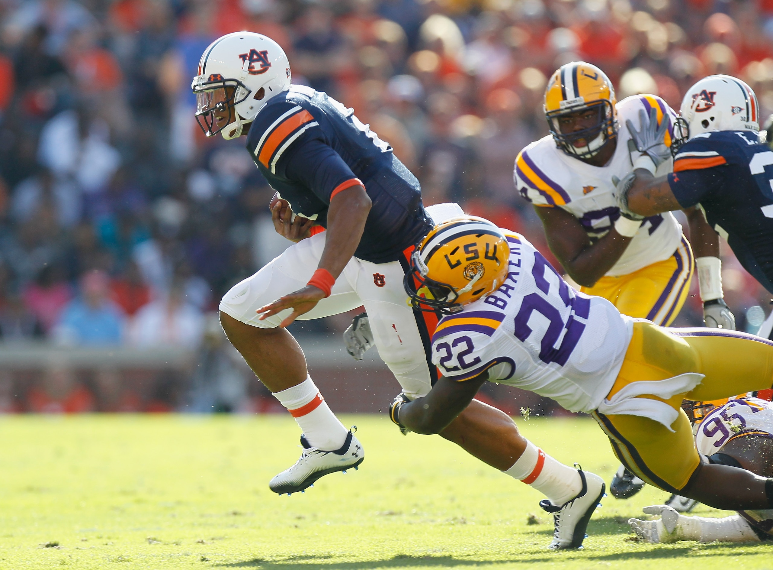 AUBURN, AL - OCTOBER 23: Quarterback Cameron Newton #2 of the Auburn Tigers against Ryan Baker #22 of the LSU Tigers at Jordan-Hare Stadium on October 23, 2010 in Auburn, Alabama. (Photo by Kevin C. Cox/Getty Images) AUBURN, AL - OCTOBER 23: Quarterback Cameron Newton #2 of the Auburn Tigers against Ryan Baker #22 of the LSU Tigers at Jordan-Hare Stadium on October 23, 2010 in Auburn, Alabama. (Photo by Kevin C. Cox/Getty Images)