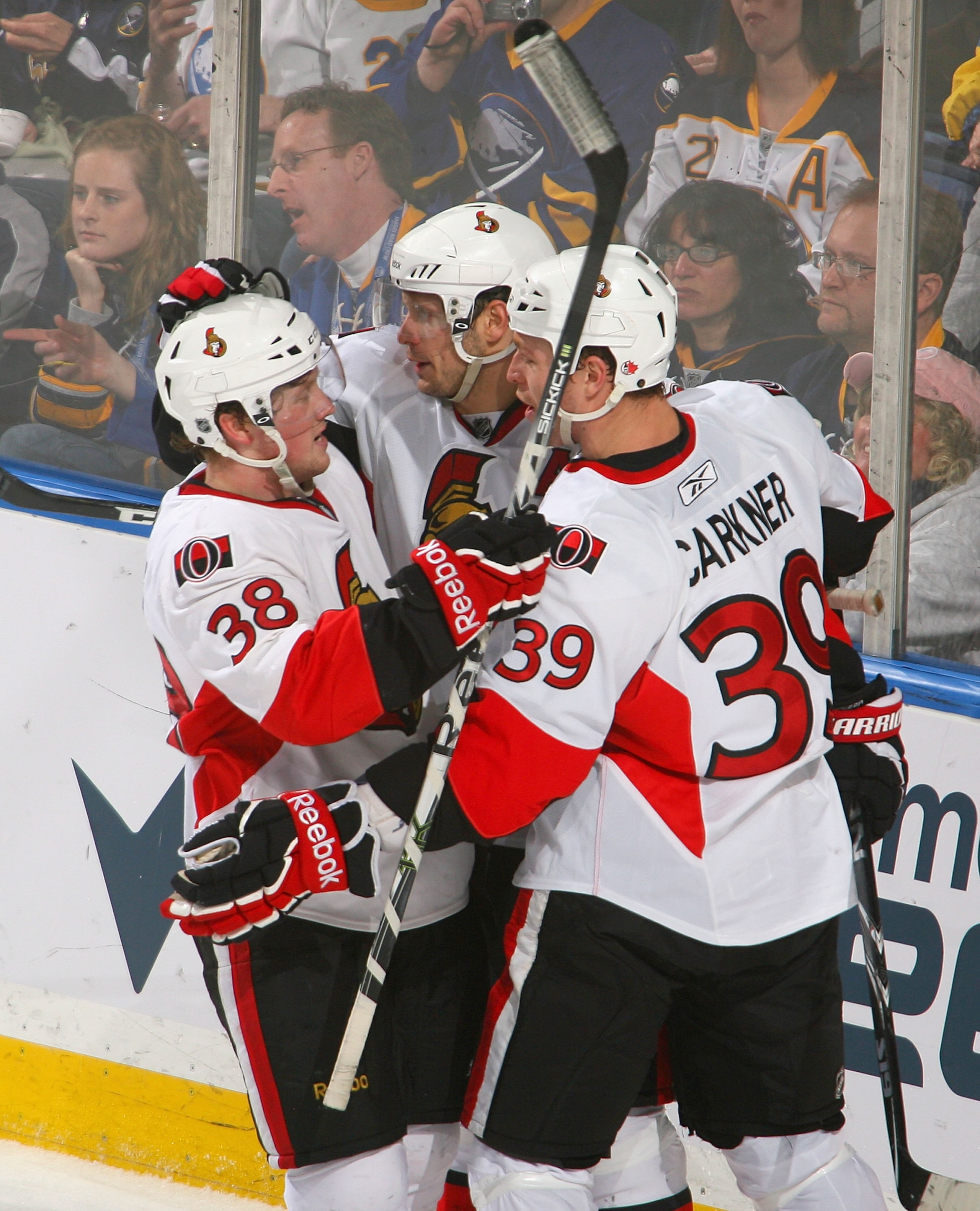 BUFFALO, NY - FEBRUARY 25: Erik Condra #38, Jason Spezza #19 and Matt Carkner #39 of the Ottawa Senators celebrate Spezza's goal in the second period against the Buffalo Sabres at HSBC Arena on February 25, 2011 in Buffalo, New York.  (Photo by Rick Stewa