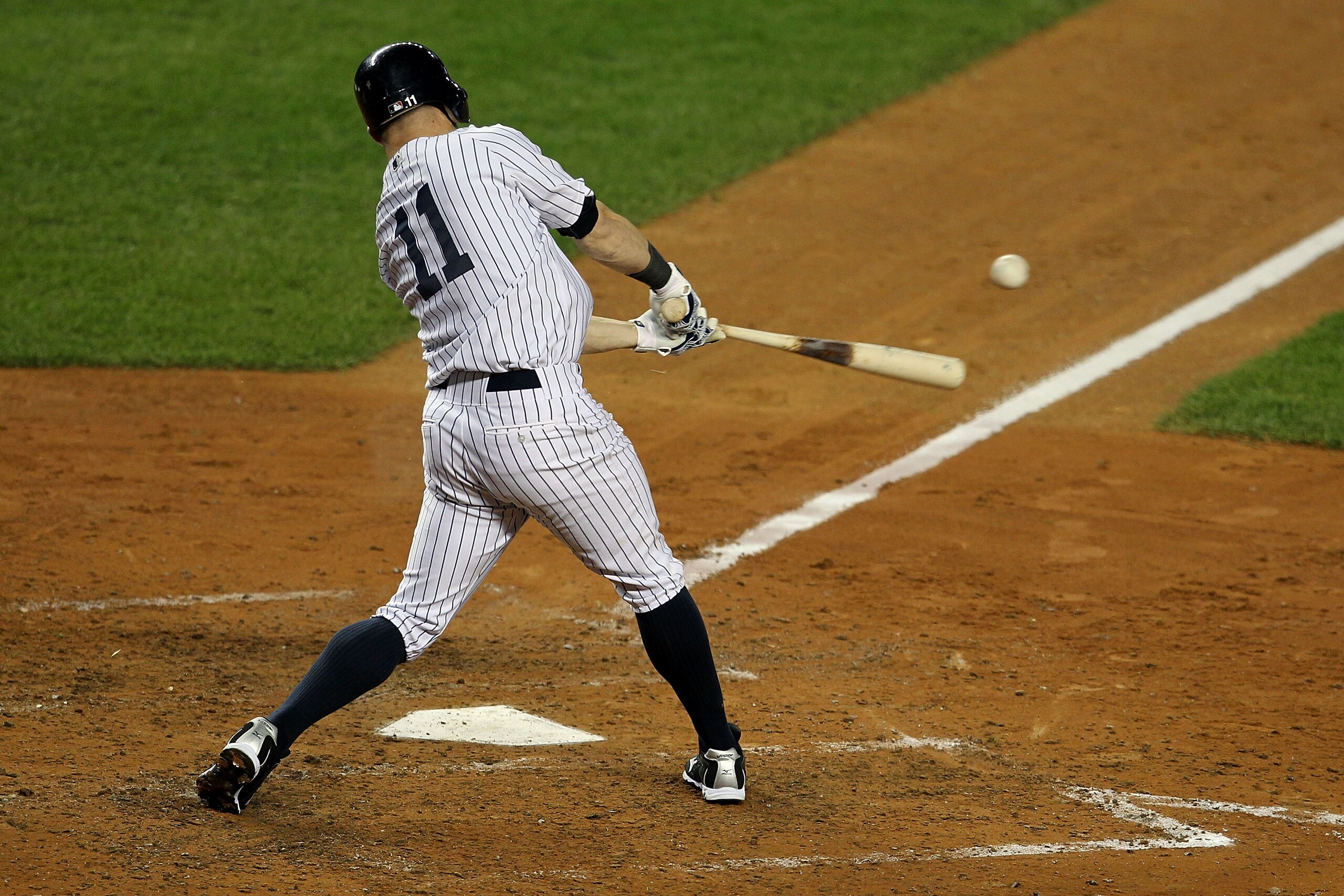 NEW YORK - OCTOBER 19:  Brett Gardner #11 of the New York Yankees breaks his bat while hitting an RBI in the fourth inning against the Texas Rangers in Game Four of the ALCS during the 2010 MLB Playoffs at Yankee Stadium on October 19, 2010 in the Bronx b