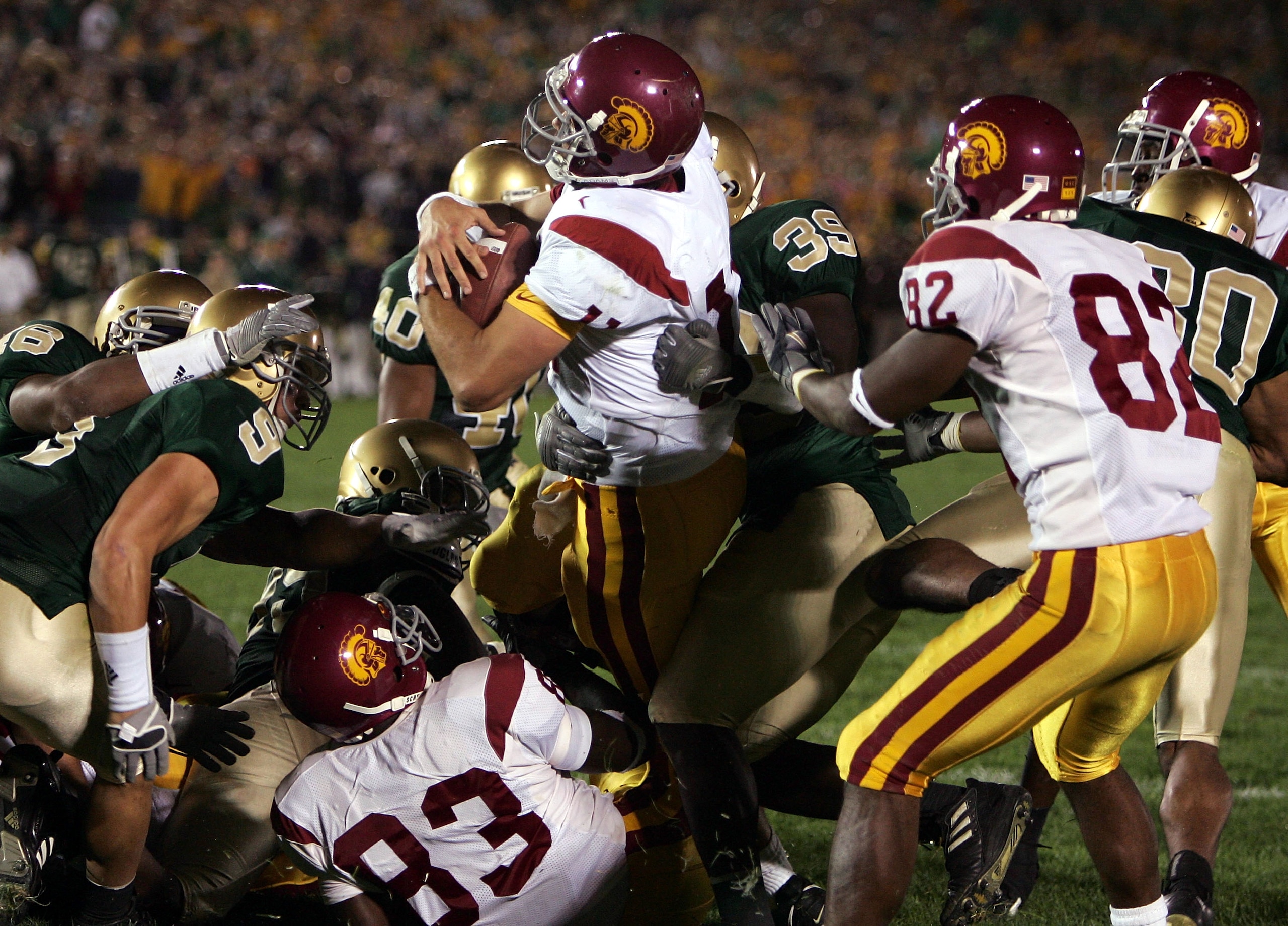 SOUTH BEND, IN - OCTOBER 15: Quarterback Matt Leinart #11 of the University of Southern California Trojans rolls into the end zone with the winning touchdown against the Notre Dame Fighting Irish on October 15, 2005 at Notre Dame Stadium in South Bend, I SOUTH BEND, IN - OCTOBER 15: Quarterback Matt Leinart #11 of the University of Southern California Trojans rolls into the end zone with the winning touchdown against the Notre Dame Fighting Irish on October 15, 2005 at Notre Dame Stadium in South Bend, I