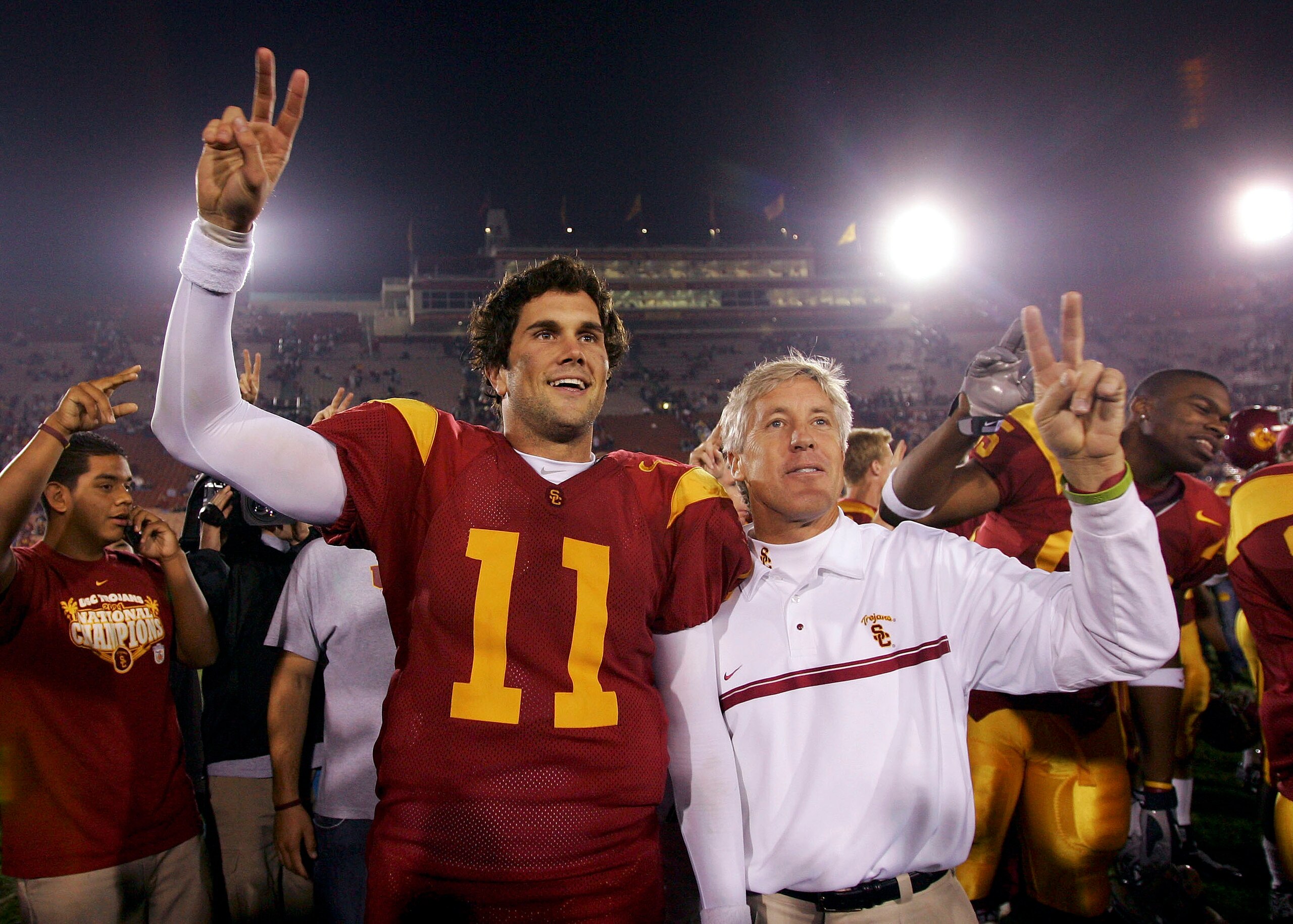 LOS ANGELES - NOVEMBER 5:  Quarterback Matt Leinart #11 and head coach Pete Carroll of the USC Trojans celebrate following their 51-21 victory over the Stanford Cardinal at the Los Angeles Memorial Coliseum on November 5, 2005 in Los Angeles, California. 
