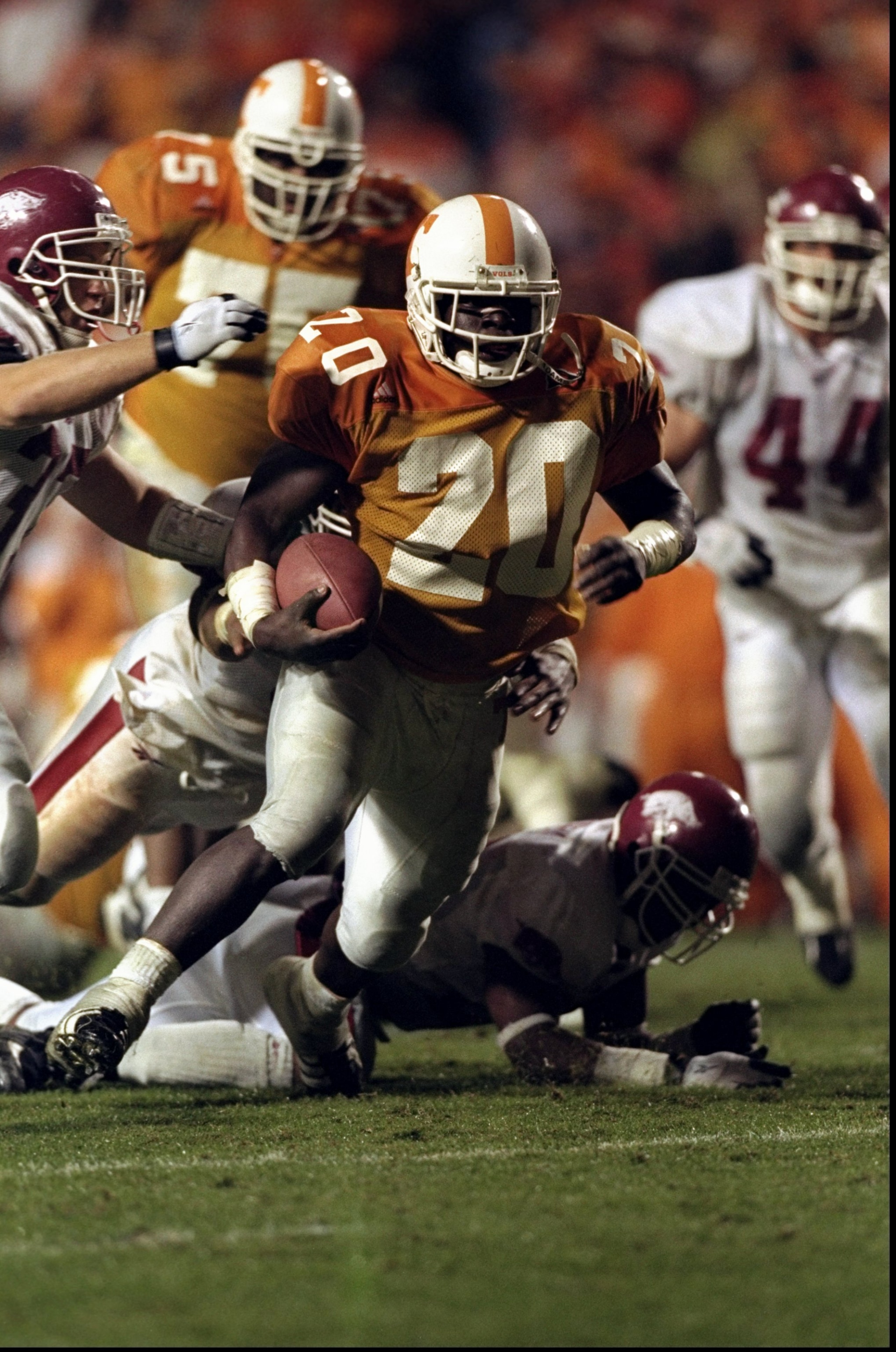 14 Nov 1998: Travis Henry #20 of the Tennessee Volunteers runs with the ball during a game against the Arkansas Razorbacks at the Neyland Stadium in Knoxville, Tennessee. The Volunteers defeated the Razorbacks 28-24. Mandatory Credit: Tom Hauck /Allspor 14 Nov 1998: Travis Henry #20 of the Tennessee Volunteers runs with the ball during a game against the Arkansas Razorbacks at the Neyland Stadium in Knoxville, Tennessee. The Volunteers defeated the Razorbacks 28-24. Mandatory Credit: Tom Hauck /Allspor