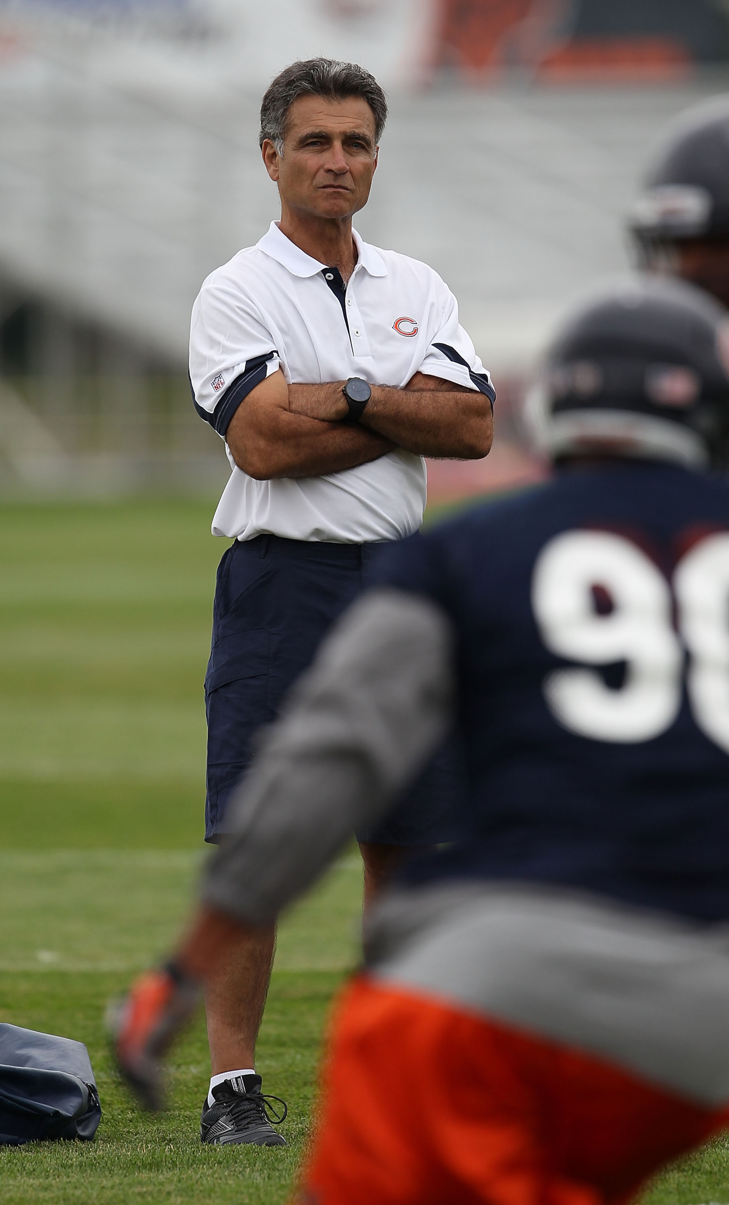 BOURBONNAIS, IL - JULY 30: General manager Jerry Angelo of the Chicago Bears watches a summer training camp practice at Olivet Nazarene University on July 30, 2010 in Bourbonnais, Illinois. (Photo by Jonathan Daniel/Getty Images)