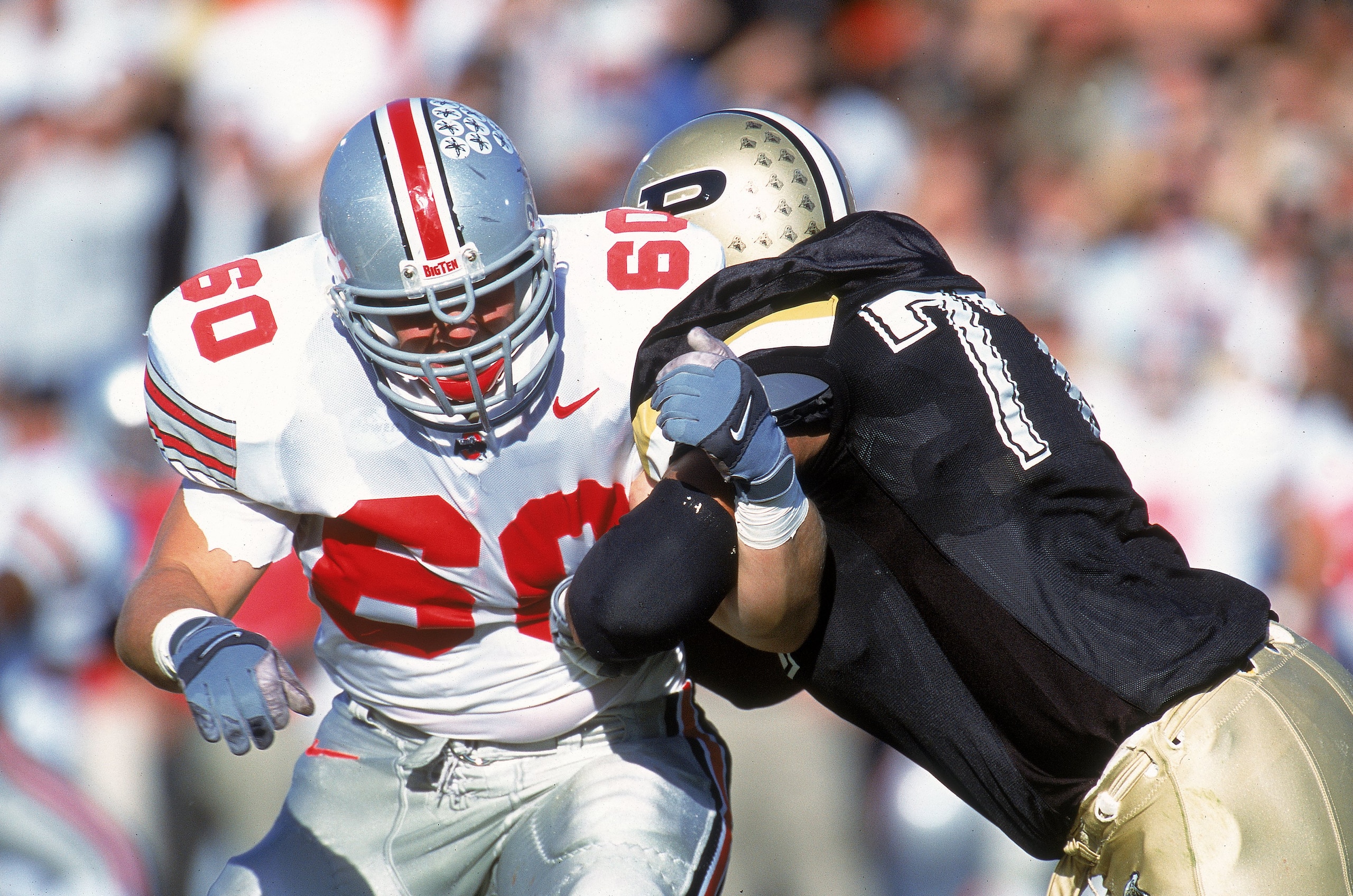 28 Oct 2000: Brent Johnson #60 of the Ohio State Buckeyes is pushed back by Brandon Gorin #77 of the Purdue Boilermakers at the Ross-Ade Stadium in Lafayette, Indiana. The Boilermakers defeated the Buckeyes 31-27.Mandatory Credit: Jonathan Daniel /Allspo 28 Oct 2000: Brent Johnson #60 of the Ohio State Buckeyes is pushed back by Brandon Gorin #77 of the Purdue Boilermakers at the Ross-Ade Stadium in Lafayette, Indiana. The Boilermakers defeated the Buckeyes 31-27.Mandatory Credit: Jonathan Daniel /Allspo