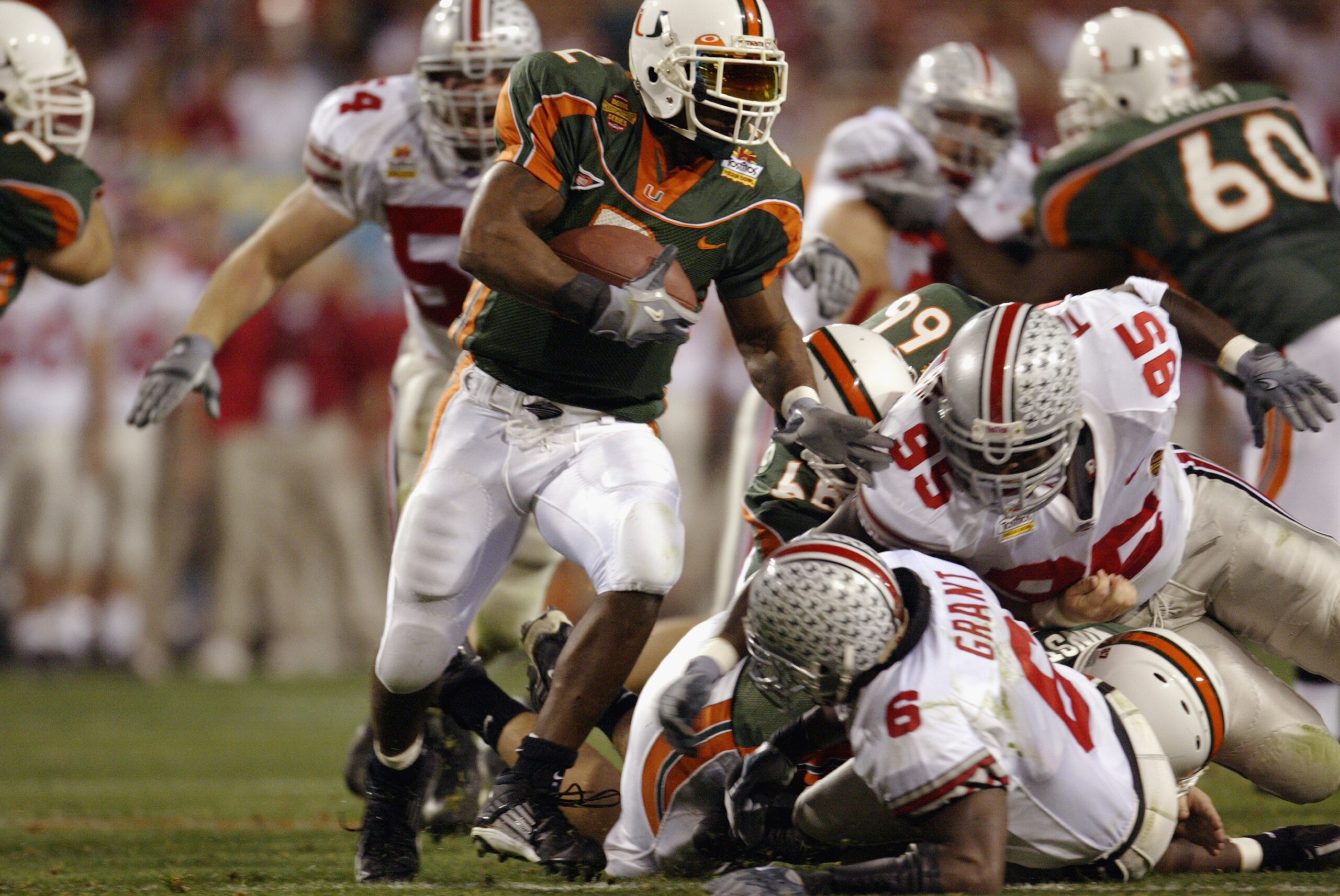 TEMPE, ARIZONA - JANUARY 3: Running back Willis McGahee #2 of the University of Miami Hurricanes runs for yards against the Ohio State Buckeyes in the Tostitos Fiesta Bowl at Sun Devil Stadium on January 3, 2003 in Tempe, Arizona. Ohio State won the gam TEMPE, ARIZONA - JANUARY 3: Running back Willis McGahee #2 of the University of Miami Hurricanes runs for yards against the Ohio State Buckeyes in the Tostitos Fiesta Bowl at Sun Devil Stadium on January 3, 2003 in Tempe, Arizona. Ohio State won the gam