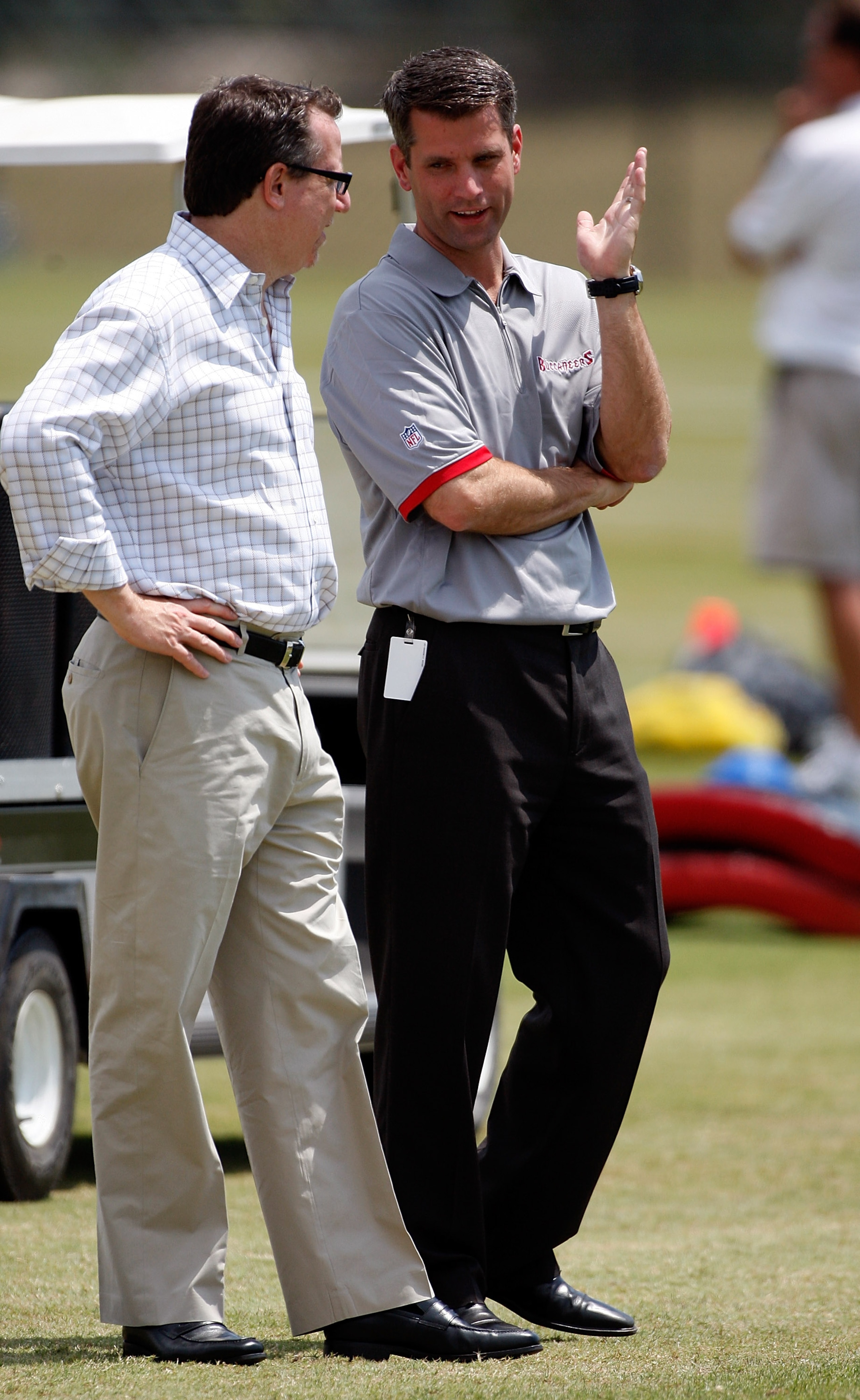 TAMPA - MAY 01:  General Manager Mark Dominik of the Tampa Bay Buccaneers talks with team owner Bryan Glazer during the Buccaneers Rookie Minicamp at One Buccaneer Place on May 1, 2009 in Tampa, Florida.  (Photo by J. Meric/Getty Images)