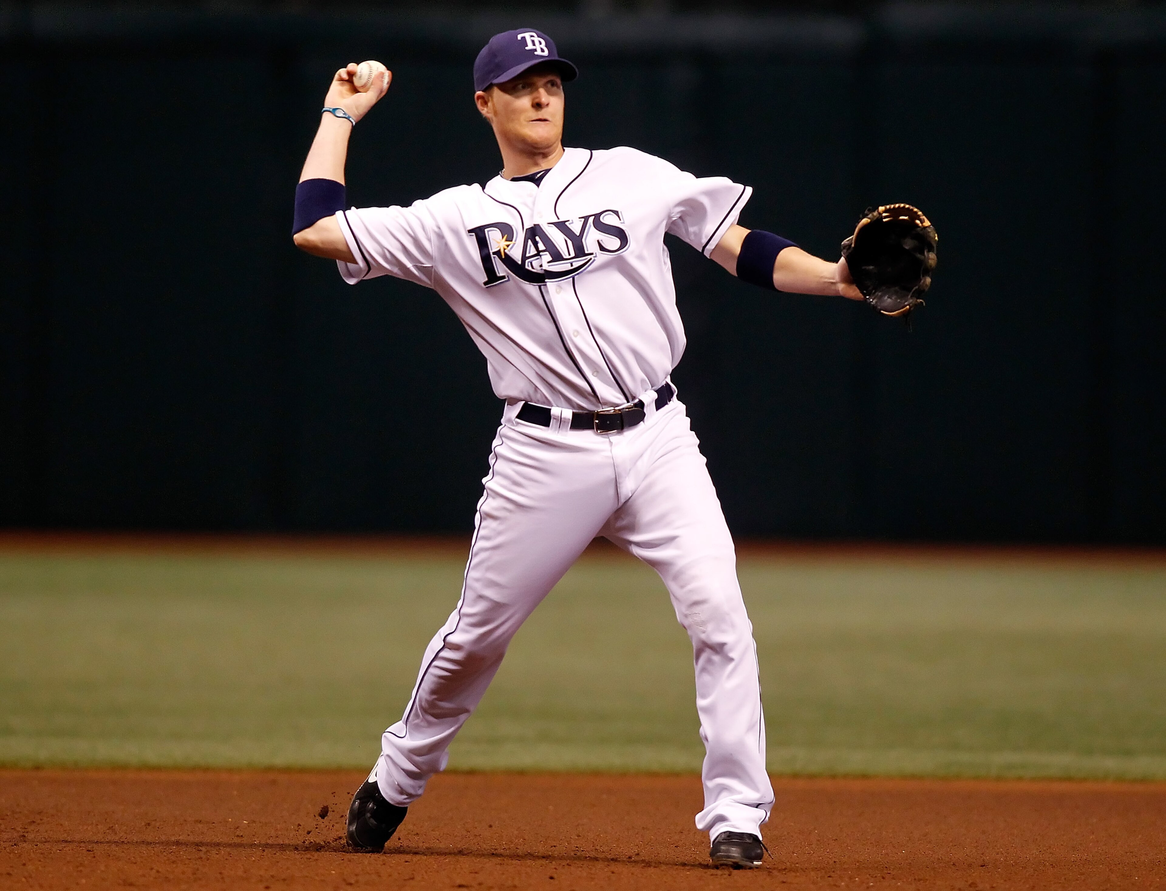 ST. PETERSBURG - SEPTEMBER 27:  Infielder Dan Johnson #24 of the Tampa Bay Rays throws to first base for an out against the Baltimore Orioles during the game at Tropicana Field on September 27, 2010 in St. Petersburg, Florida.  (Photo by J. Meric/Getty Im