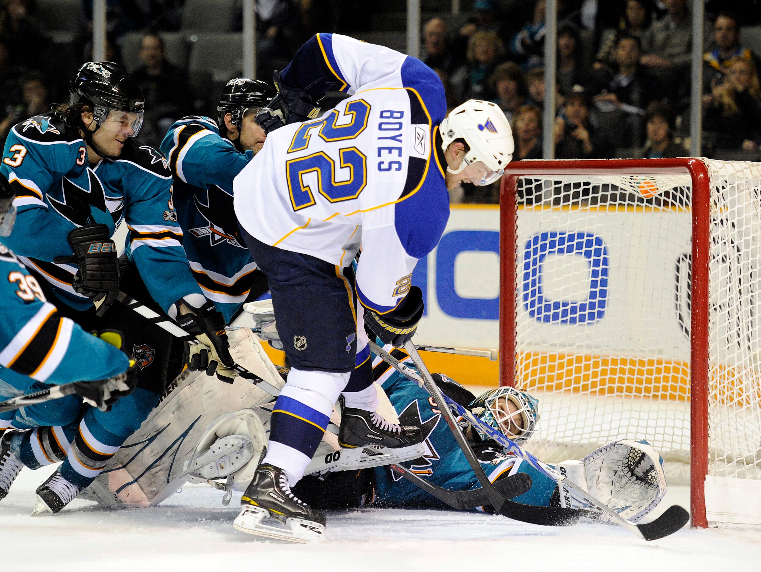 SAN JOSE, CA - JANUARY 15:  Goalie Antti Niemi #31of the San Jose Sharks gets help from teammates Dan Boyle #22 and Douglas Murray #3 stopping the shot of Brad Boyes #22 of the St. Louis Blues in the third period of an NHL hockey game at the HP Pavilion o
