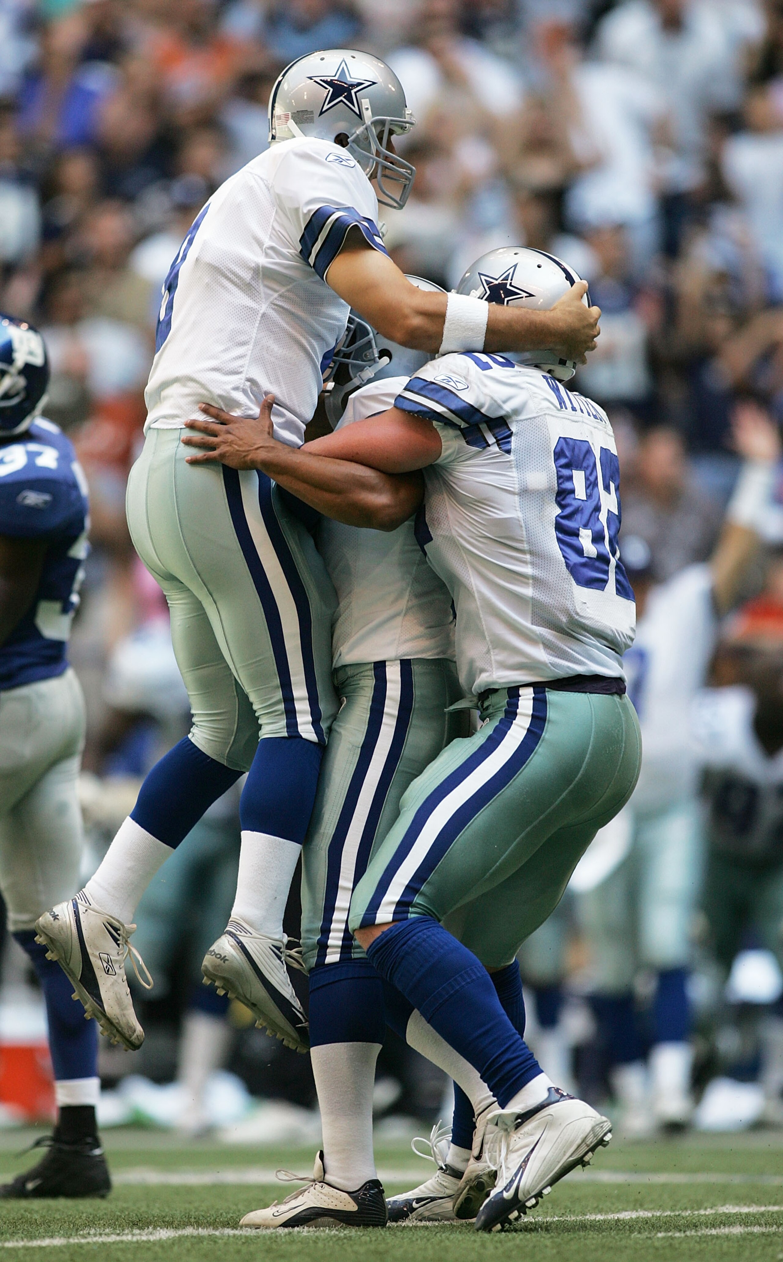 IRVING, TX - OCTOBER 16: Place kicker Jose Cortez #2 of the Dallas Cowboys celebrates with teammates Tony Romo #9 and Jason Witten #82 after Cortez kicked the game winning field goal in overtime against the New York Giants on October 16, 2005 at Texas Sta