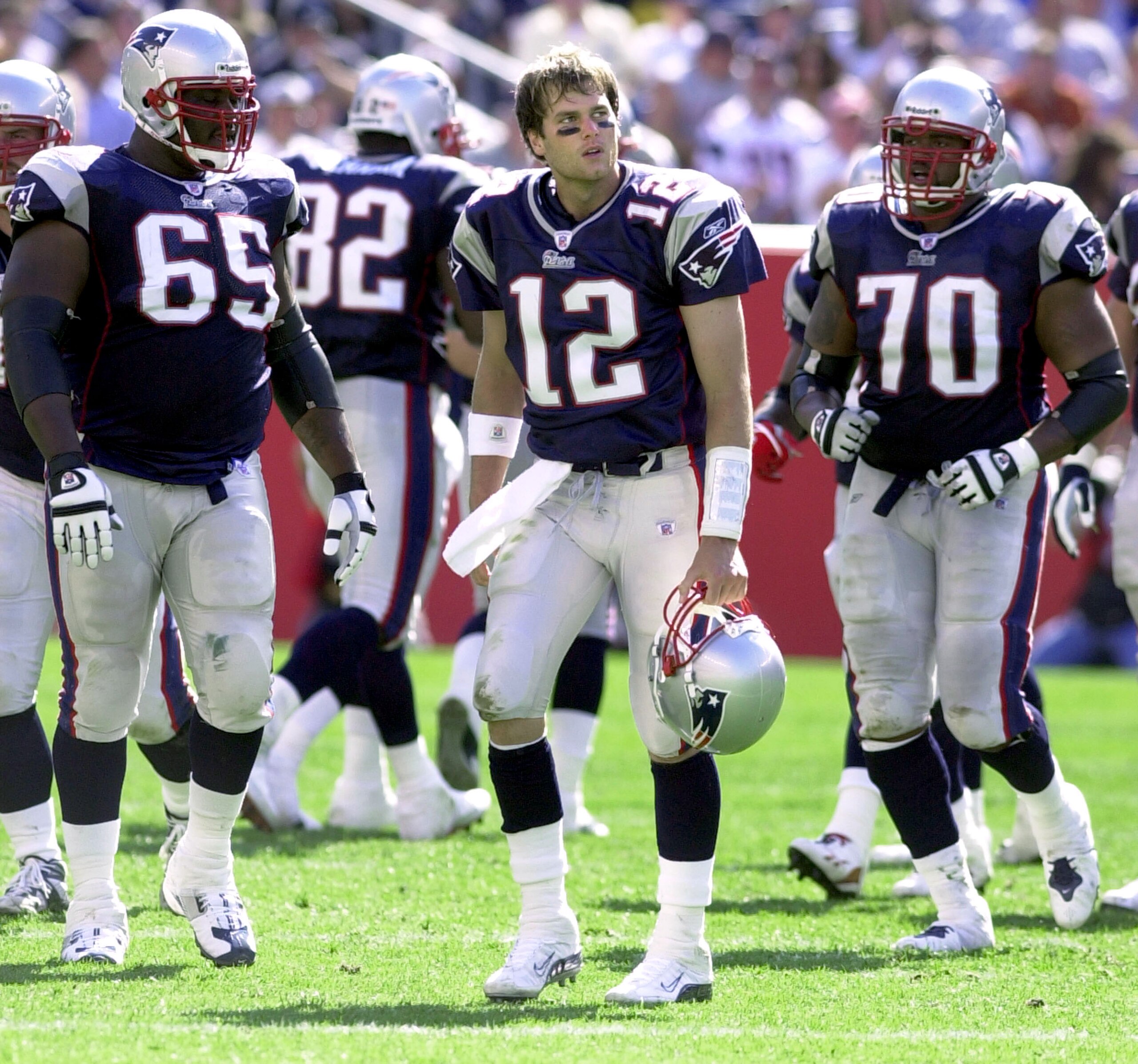 FOXBORO, MA - SEPTEMBER 21:  Quarterback Tom Brady #12 of the New England Patriots reacts to being sacked by the New York Jets during game action at Gillette Stadium September 21, 2003 in Foxboro, Massachusetts. This is the New England Patriots' home open