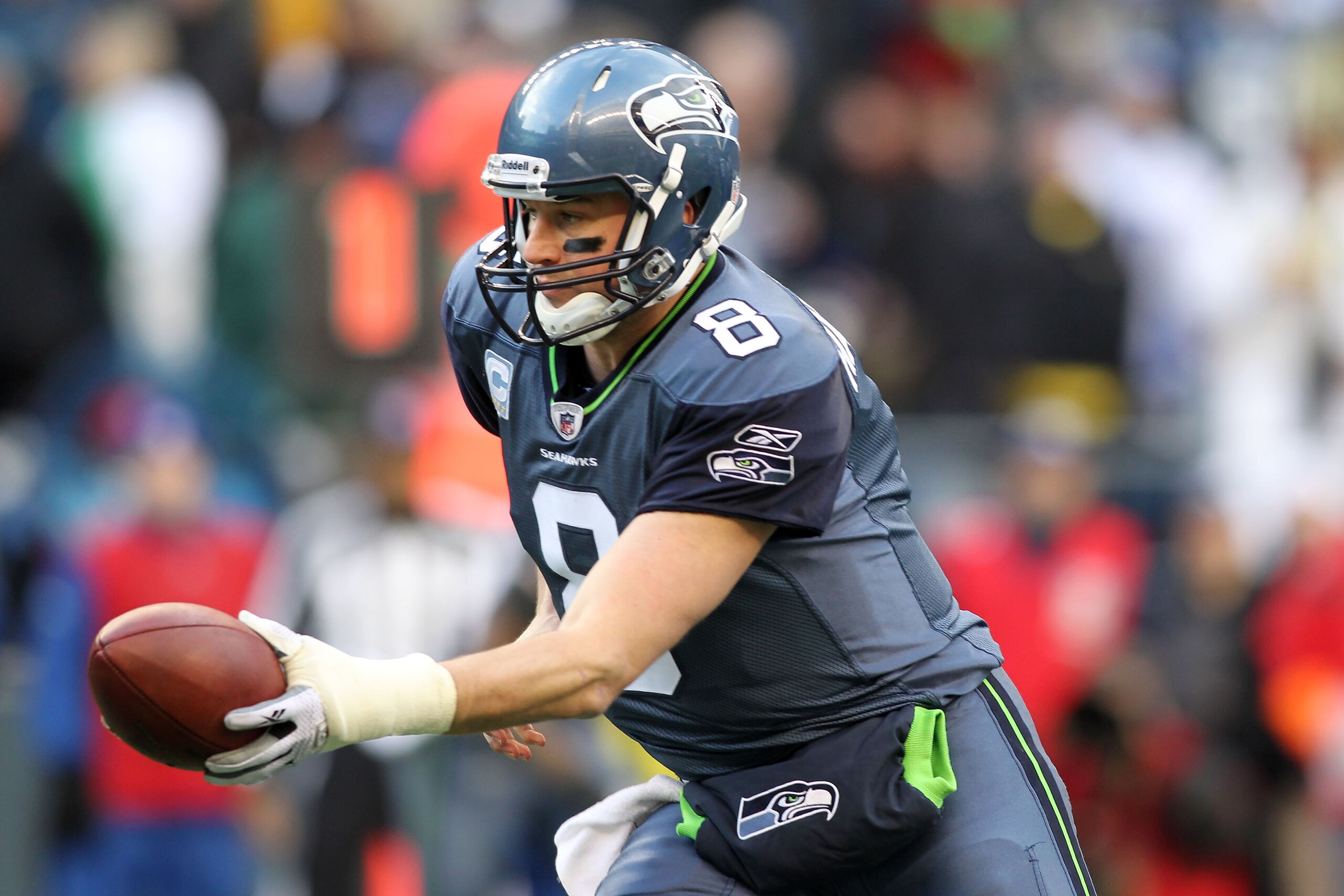 SEATTLE, WA - JANUARY 08:  Matt Hasselbeck #8 of the Seattle Seahawks runs a play against the New Orleans Saints during the 2011 NFC wild-card playoff game at Qwest Field on January 8, 2011 in Seattle, Washington.  (Photo by Jonathan Ferrey/Getty Images)