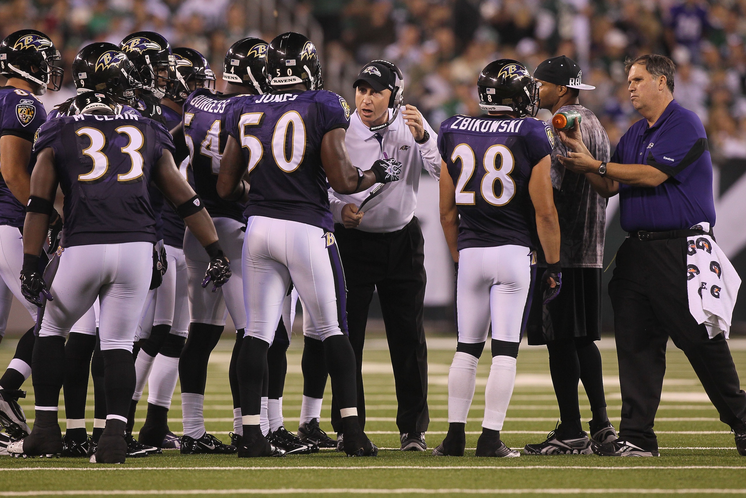 EAST RUTHERFORD, NJ - SEPTEMBER 13:  The Baltimore Ravens stand on the field against the New York Jets during their home opener at the New Meadowlands Stadium on September 13, 2010 in East Rutherford, New Jersey.  (Photo by Jim McIsaac/Getty Images)