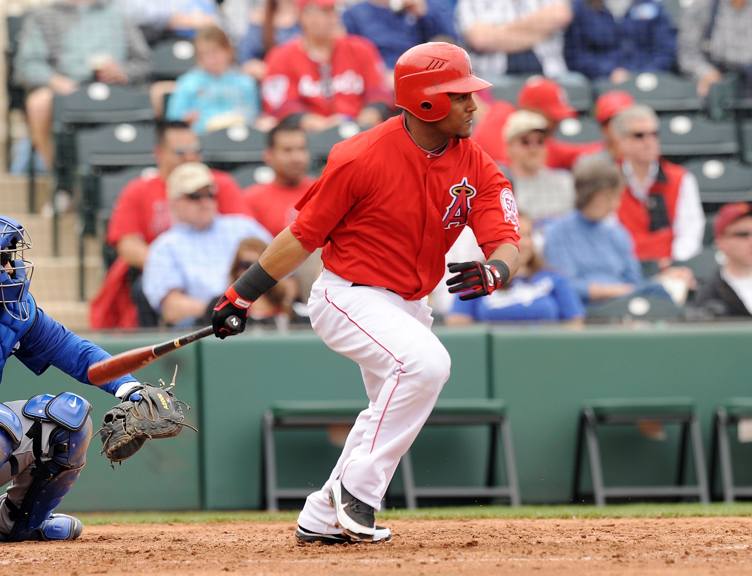 TEMPE, AZ - FEBRUARY 26: Erick Aybar #2 of the Los Angeles Angels of Anaheim hits the ball through the left side of the Los Angeles Dodgers infield at Tempe Diablo Stadium on February 26, 2011 in Tempe, Arizona. (Photo by Norm Hall/Getty Images) TEMPE, AZ - FEBRUARY 26: Erick Aybar #2 of the Los Angeles Angels of Anaheim hits the ball through the left side of the Los Angeles Dodgers infield at Tempe Diablo Stadium on February 26, 2011 in Tempe, Arizona. (Photo by Norm Hall/Getty Images)