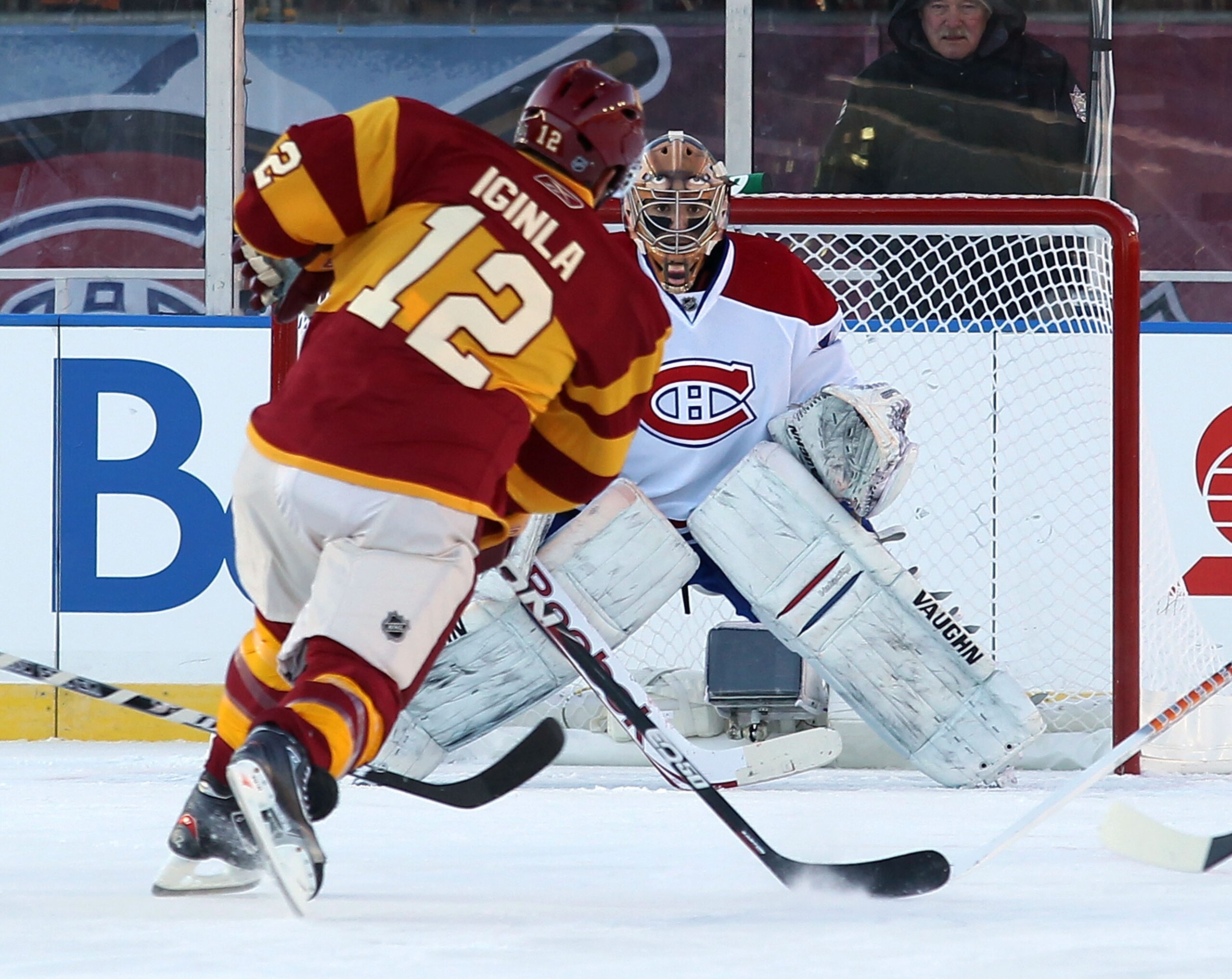CALGARY, AB - FEBRUARY 20: Jarome Iginla #12 of the Calgary Flames takes the shot against Carey Price #31 of the Montreal Canadiens during the 2011 NHL Heritage Classic Game at McMahon Stadium on February 20, 2011 in Calgary, Alberta, Canada. The Flames d