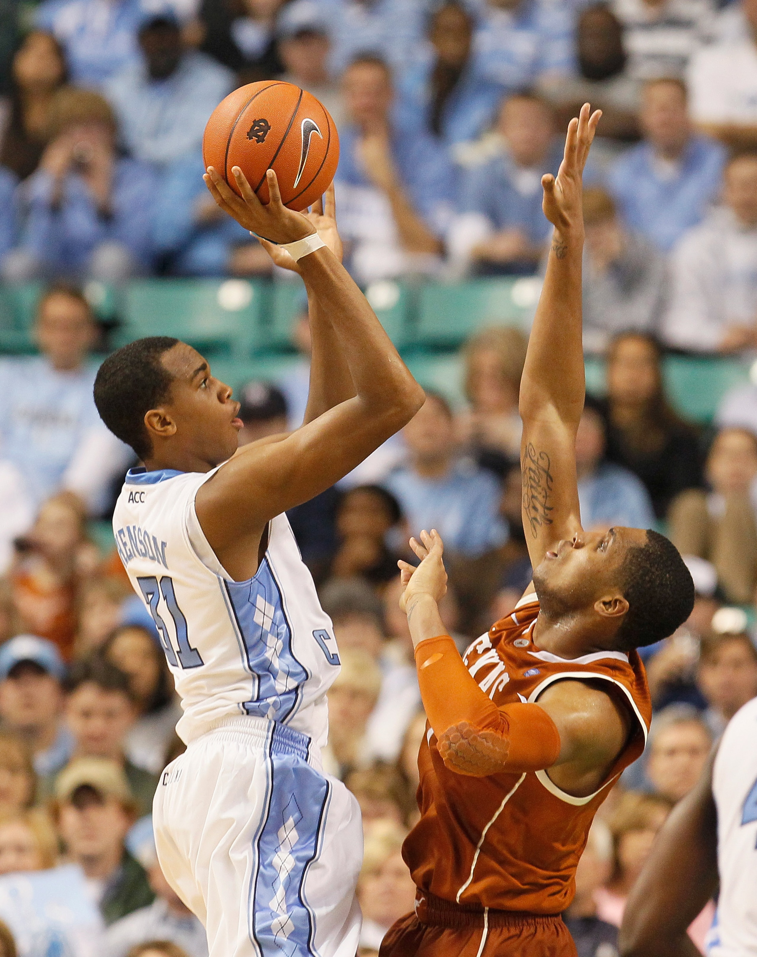 GREENSBORO, NC - DECEMBER 18:  John Henson #31 of the North Carolina Tar Heels against Gary Johnson #1 of the Texas Longhorns at Greensboro Coliseum on December 18, 2010 in Greensboro, North Carolina.  (Photo by Kevin C. Cox/Getty Images)