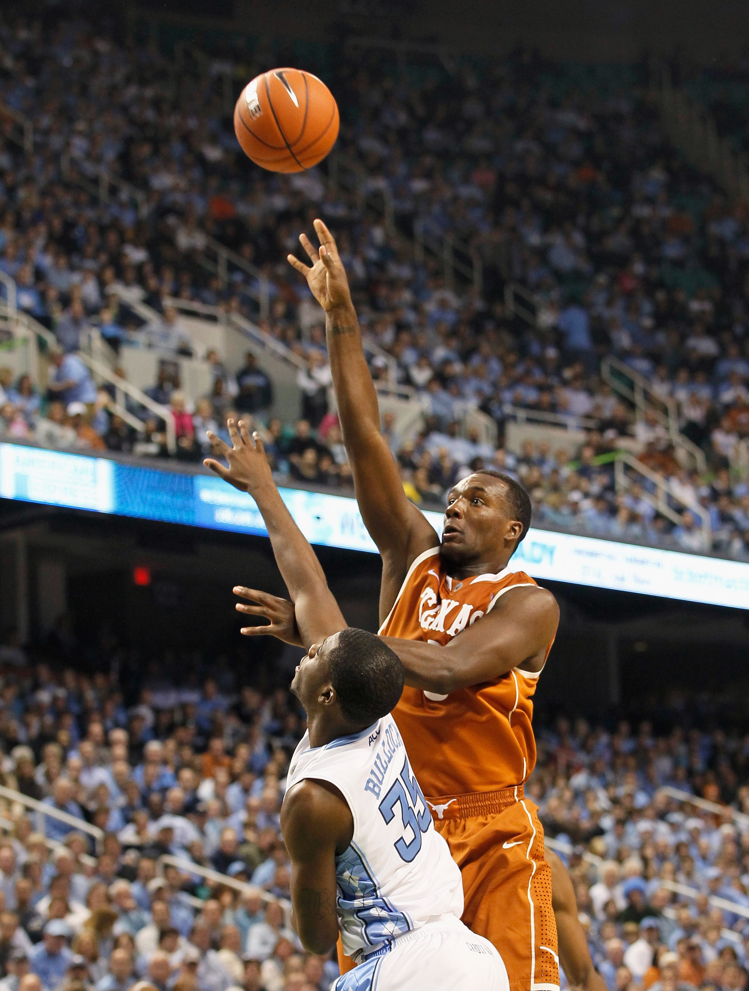 GREENSBORO, NC - DECEMBER 18:  Jordan Hamilton #3 of the Texas Longhorns against Reggie Bullock #35 of the North Carolina Tar Heels at Greensboro Coliseum on December 18, 2010 in Greensboro, North Carolina.  (Photo by Kevin C. Cox/Getty Images)