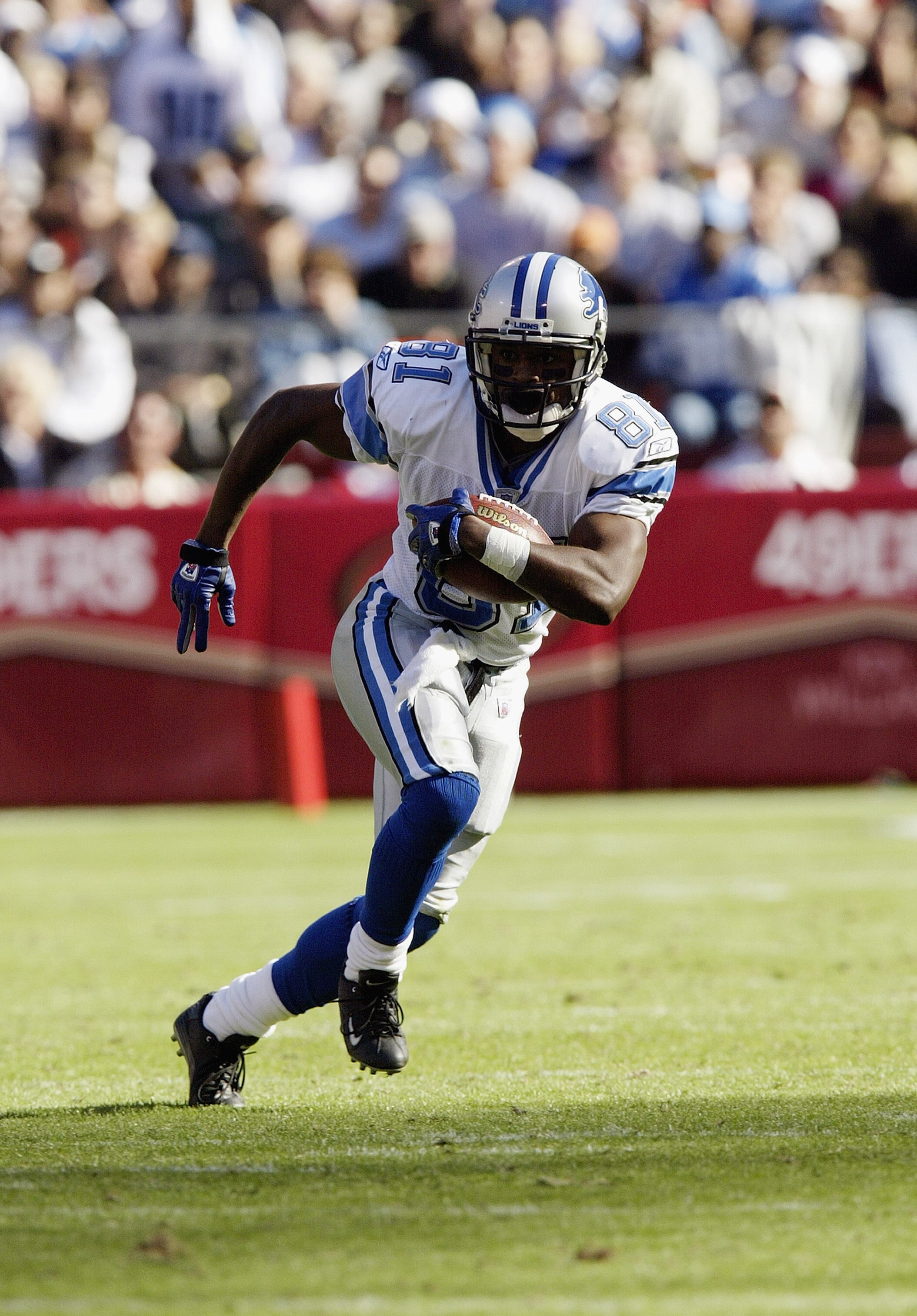 SAN FRANCISCO - OCTOBER 5:  Wide receiver Az-Zahir Hakim #81 of the Detroit Lions looks for more yards after the catch in a game against the San Francisco 49ers on October 5, 2003 at 3Com Park in San Francisco, California.  The 49ers defeated the Lions 24