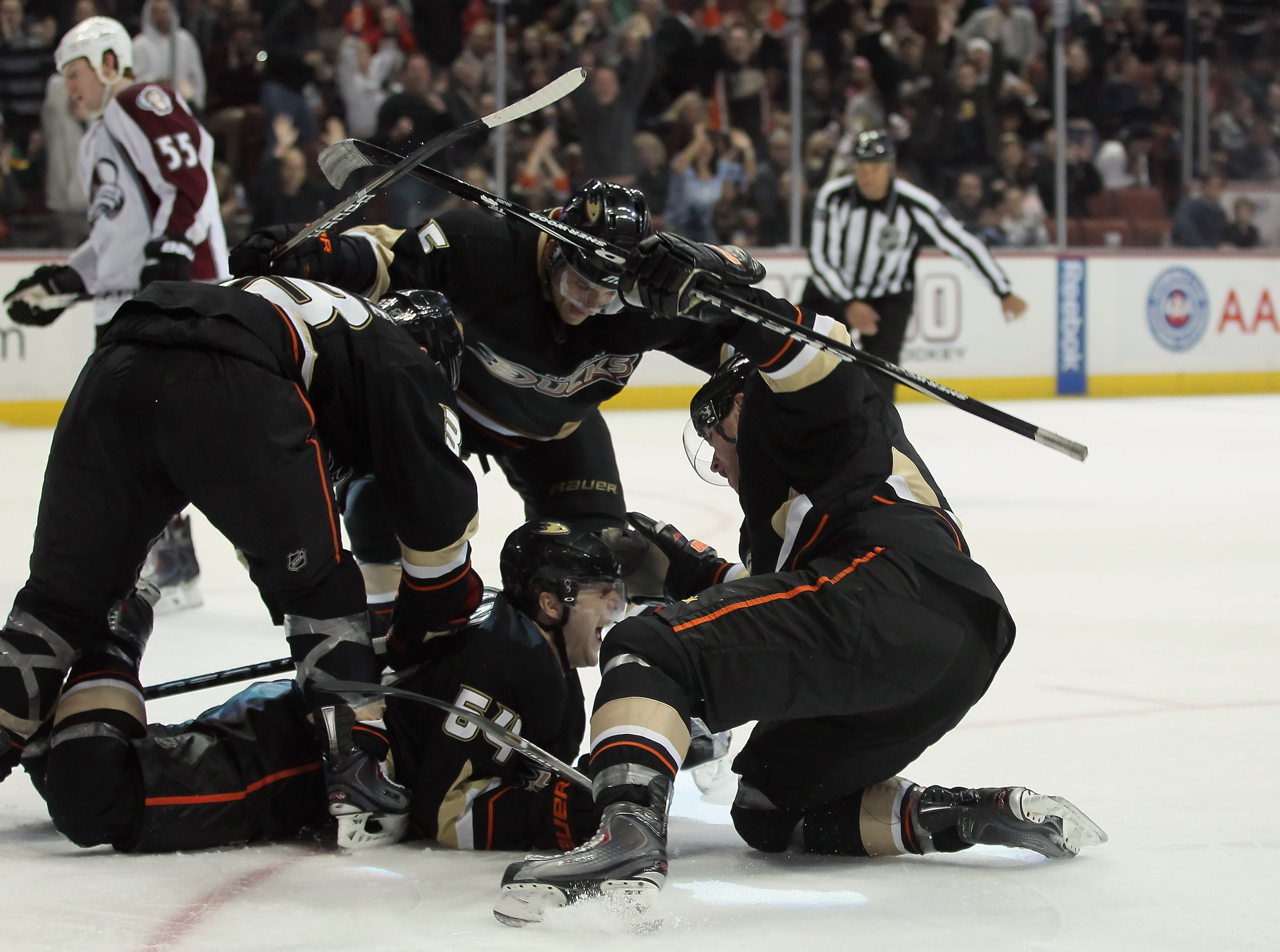 ANAHEIM, CA - FEBRUARY 27:  (clockwise from top) Luca Sbisa #5, Bobby Ryan #9, Brandon McMillan #64 and Jason Blake #33 of the Anaheim Ducks celebrate McMillan's go ahead goal in the third period against the Colorado Avalanche at Honda Center on February