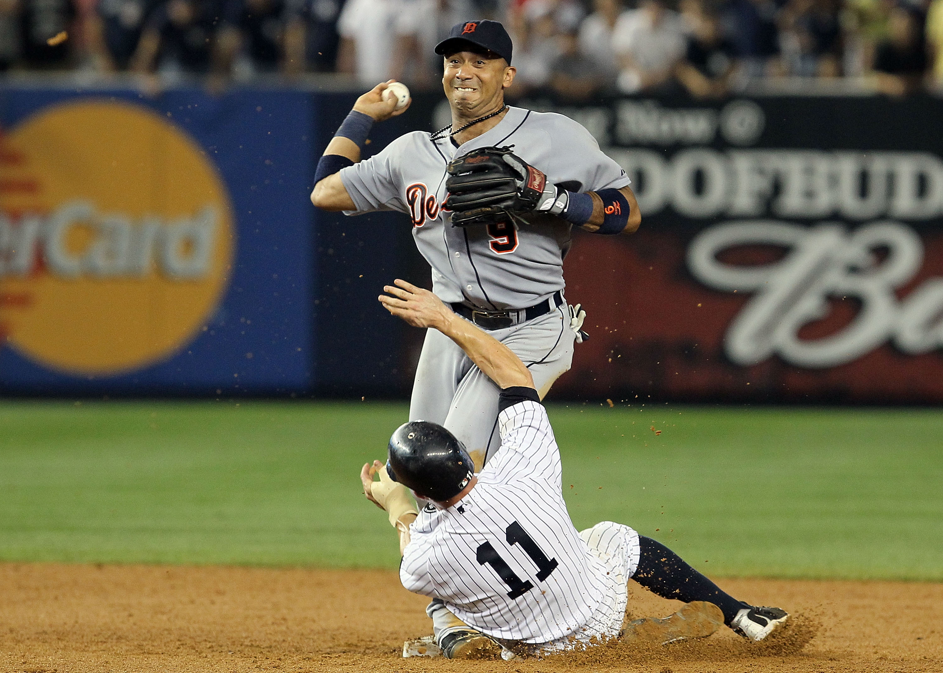 NEW YORK - AUGUST 16:  Carlos Guillen #9 of the Detroit Tigers completes a game ending double play after forcing out Brett Gardner #11 of the New York Yankees on August 16, 2010 at Yankee Stadium in the Bronx borough of New York City. The Tigers defeated 
