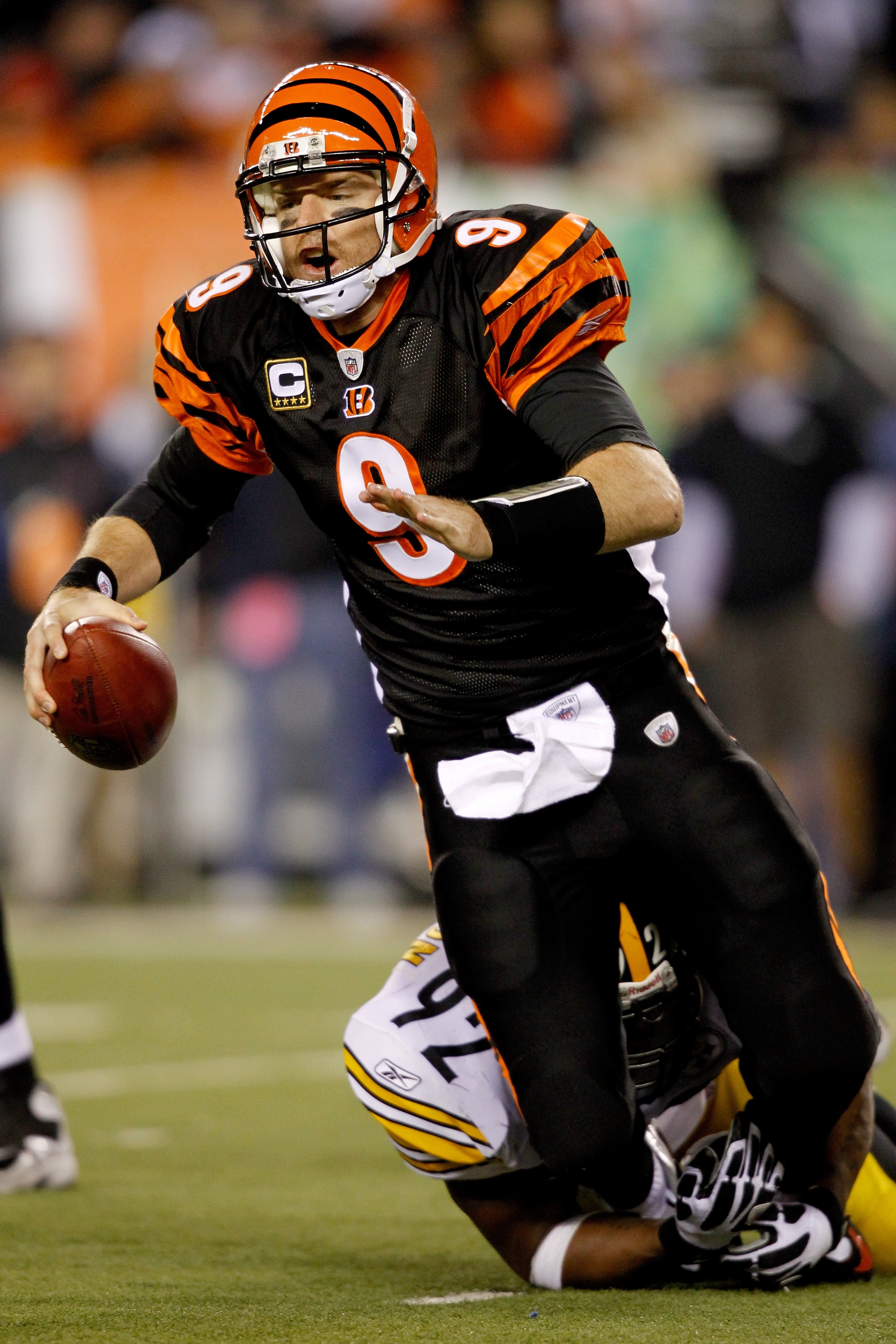 CINCINNATI - NOVEMBER 08:  Carson Palmer #9 of the Cincinnati Bengals is brought down from behind by James Harrison #92 of the Pittsburgh Steelers at Paul Brown Stadium on November 8, 2010 in Cincinnati, Ohio.  (Photo by Matthew Stockman/Getty Images)