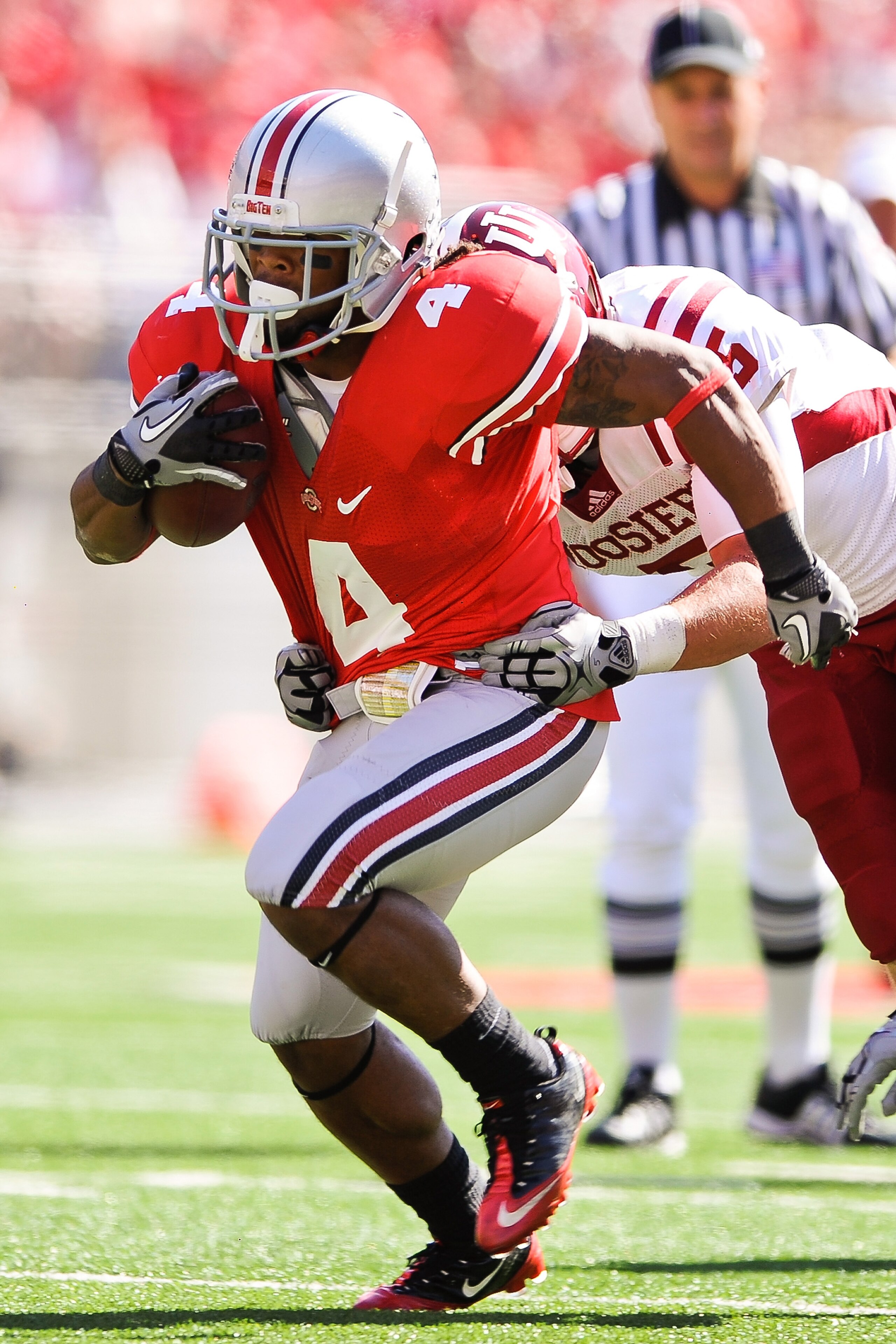 COLUMBUS, OH - OCTOBER 9:  Jaamal Berry #4 of the Ohio State Buckeyes runs with the ball against the Indiana Hoosiers at Ohio Stadium on October 9, 2010 in Columbus, Ohio.  (Photo by Jamie Sabau/Getty Images)