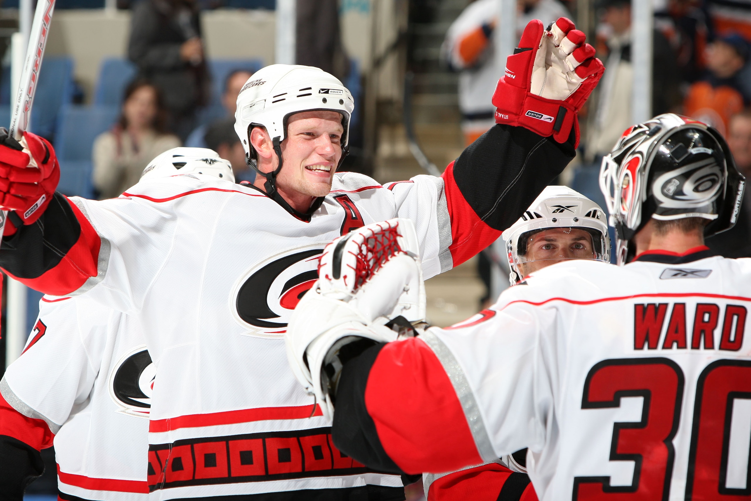UNIONDALE, NY - OCTOBER 25: Eric Staal #12 and Cam Ward #30 of the Carolina Hurricanes celebrate after defeating the New York Islanders on October 25, 2008 at the Nassau Veterans Memorial Coliseum in Uniondale, New York. The Hurricanes defeated the Island