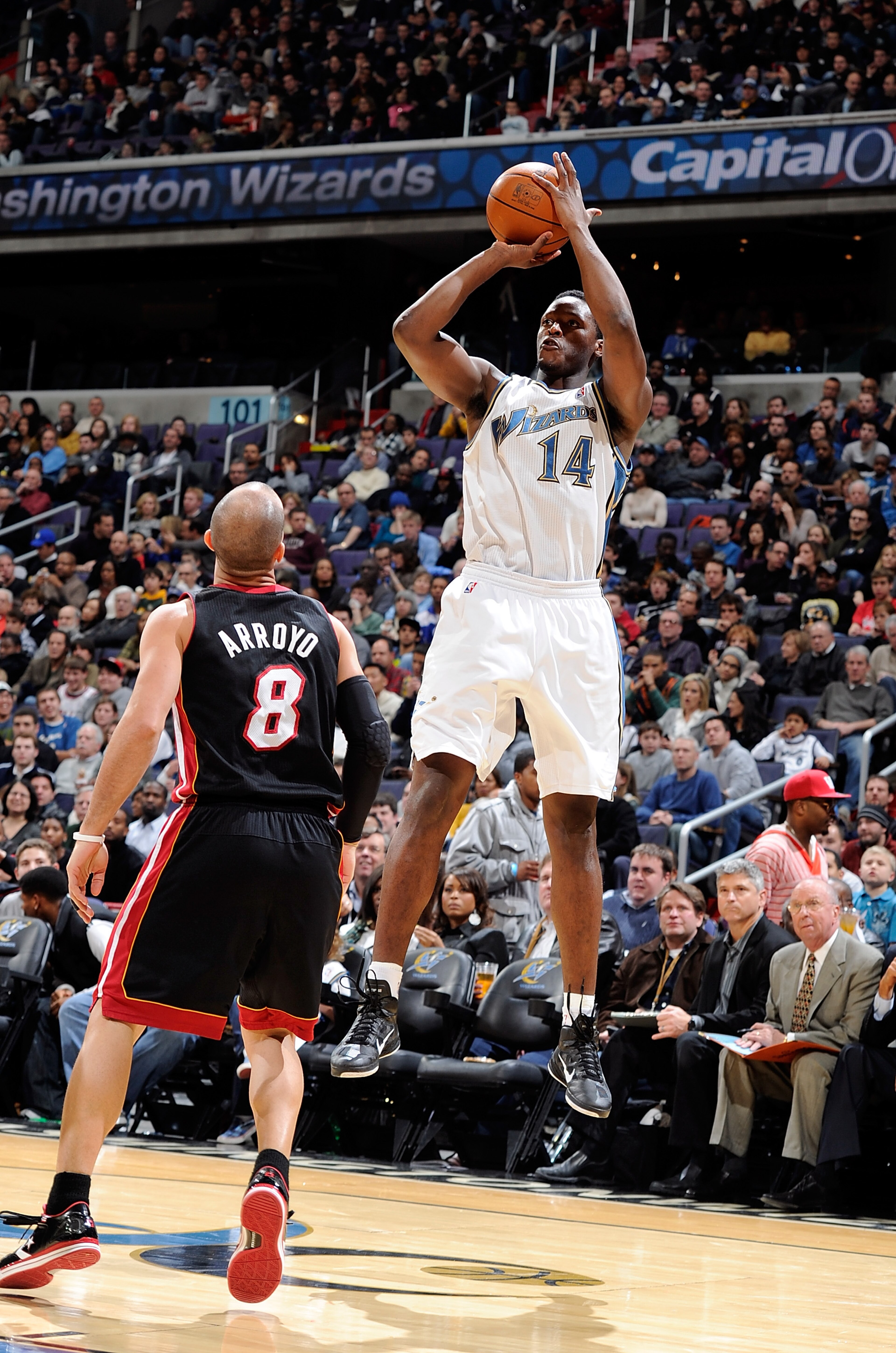 WASHINGTON, DC - DECEMBER 18: Al Thornton #14 of the Washington Wizards shoots over Carlos Arroyo #8 of the Miami Heat at the Verizon Center on December 18, 2010 in Washington, DC. NOTE TO USER: User expressly acknowledges and agrees that, by downloadin WASHINGTON, DC - DECEMBER 18: Al Thornton #14 of the Washington Wizards shoots over Carlos Arroyo #8 of the Miami Heat at the Verizon Center on December 18, 2010 in Washington, DC. NOTE TO USER: User expressly acknowledges and agrees that, by downloadin