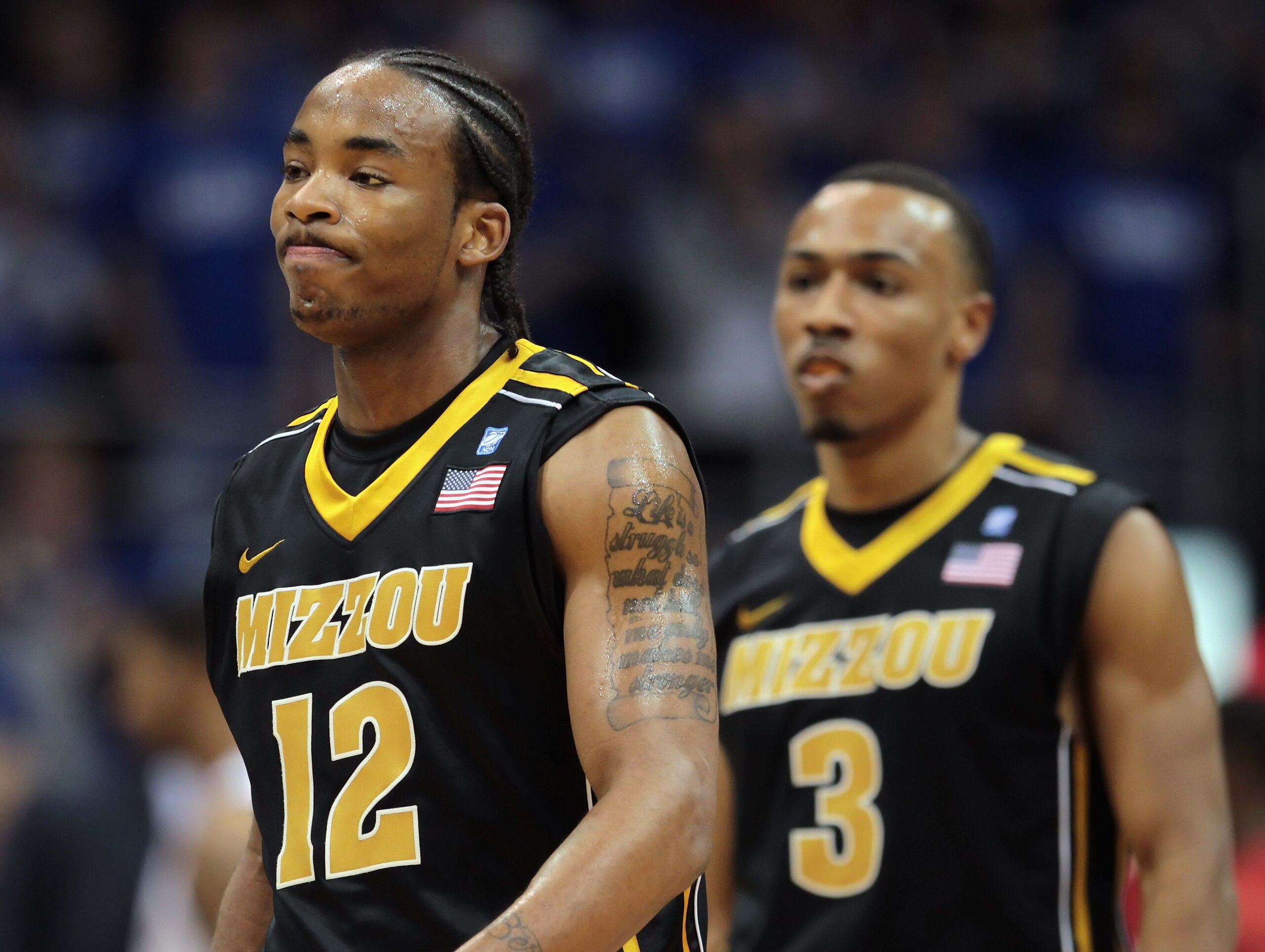 LAWRENCE, KS - FEBRUARY 07:  Marcus Denmon #12 and Matt Pressey #3 of the Missouri Tigers reacts after a foul during the game against the Kansas Jayhawks on February 5, 2011 at Allen Fieldhouse in Lawrence, Kansas.  (Photo by Jamie Squire/Getty Images)