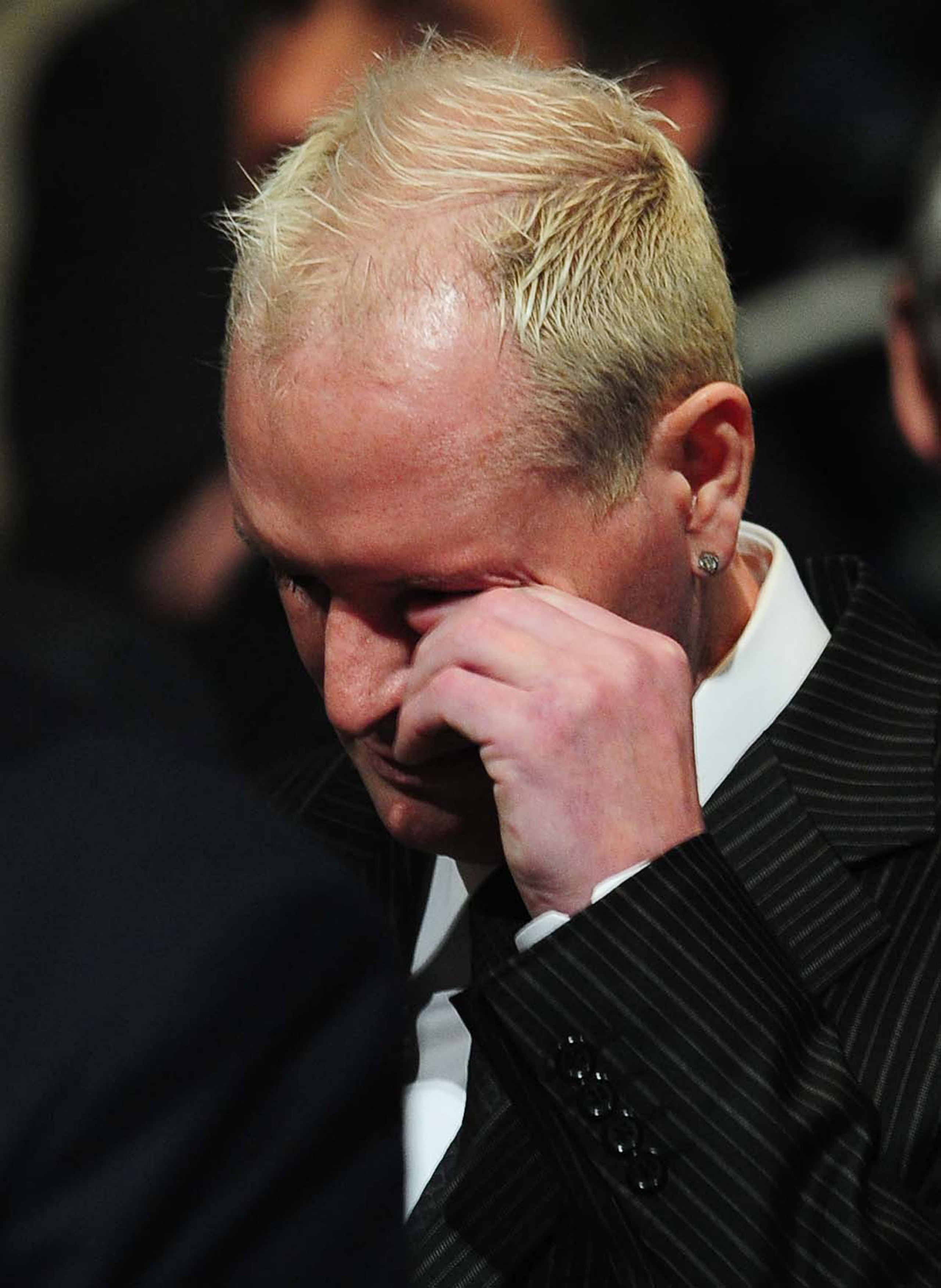 DURHAM, ENGLAND - SEPTEMBER 21:  Paul Gascoigne wipes his eye during the Sir Bobby Robson Memorial Service at Durham Cathedral on September 21, 2009 in Durham, England. Thousands of football fans are expected to pay tribute to the former England footballe