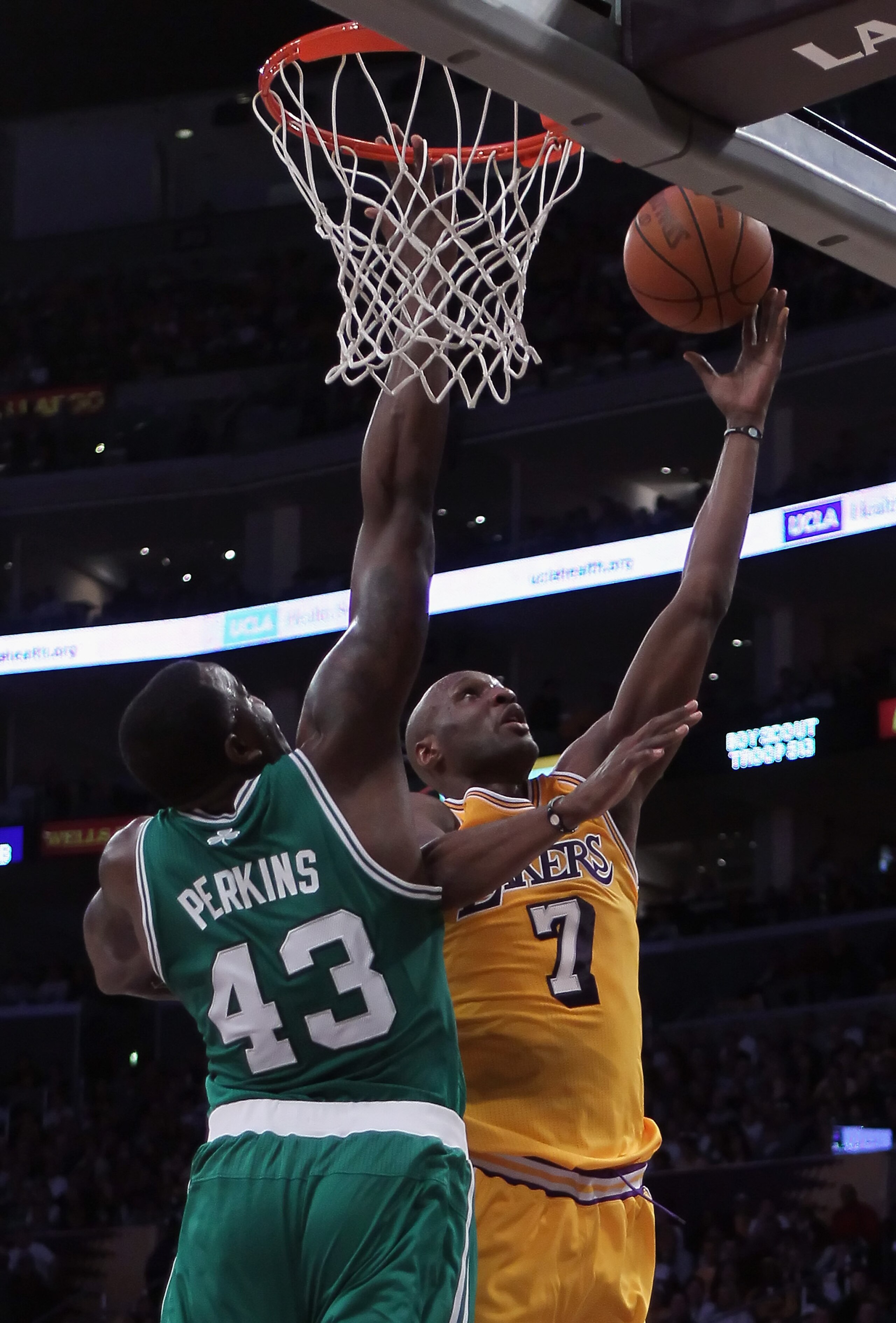 LOS ANGELES, CA - JANUARY 30:  Lamar Odom #7 of the Los Angeles Lakers drives to the basket past Kendrick Perkins #43 of the Boston Celtics in the first half at Staples Center on January 30, 2011 in Los Angeles, California.  (Photo by Jeff Gross/Getty Ima