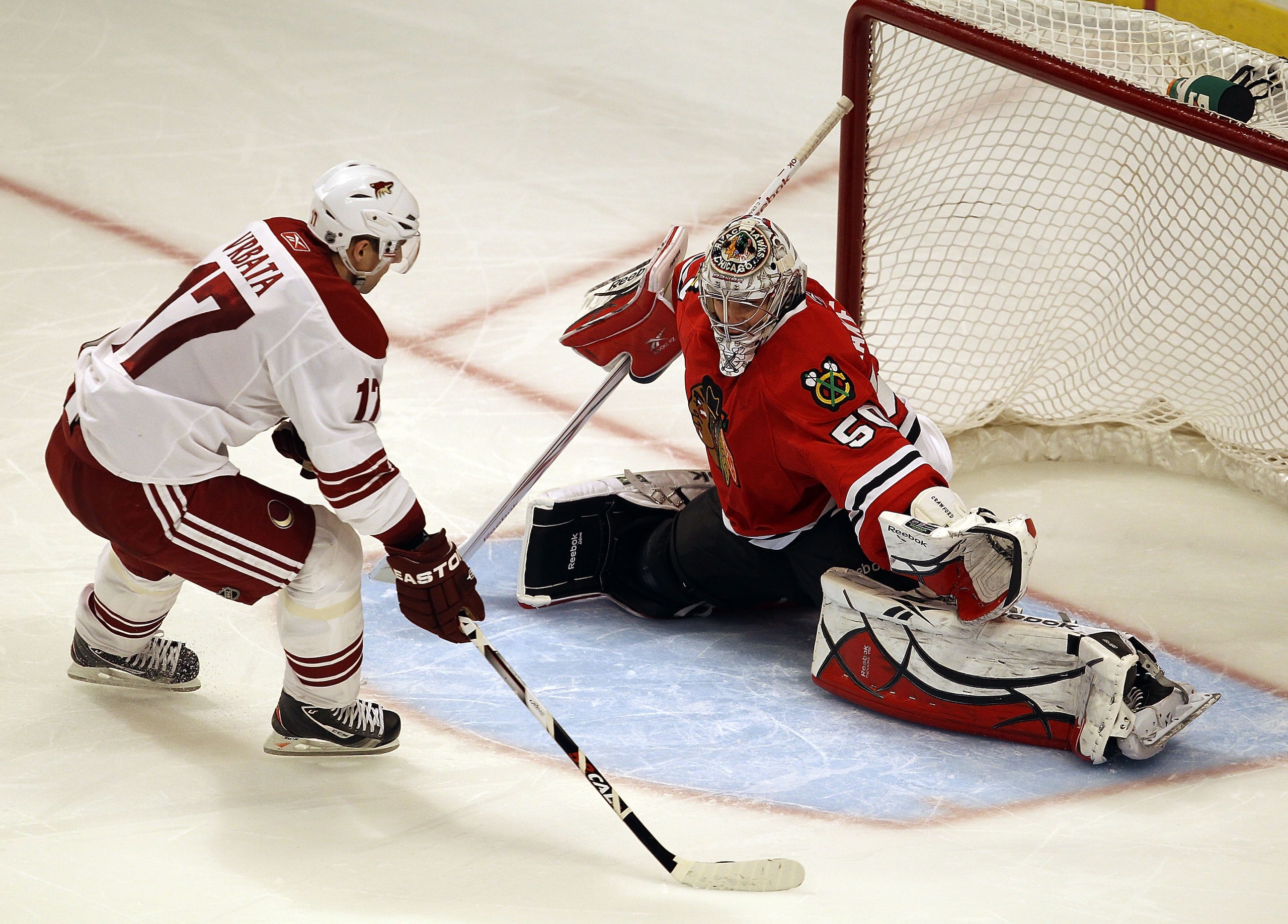 CHICAGO, IL - FEBRUARY 27: Corey Crawford #50 of the Chicago Blackhawks moves to stop a shot in the shootout by Radim Vrbata #17 of the Phoenix Coyotes at the United Center on February 27, 2011 in Chicago, Illinois. The Blackhawks defeated the Coyotes 4-3