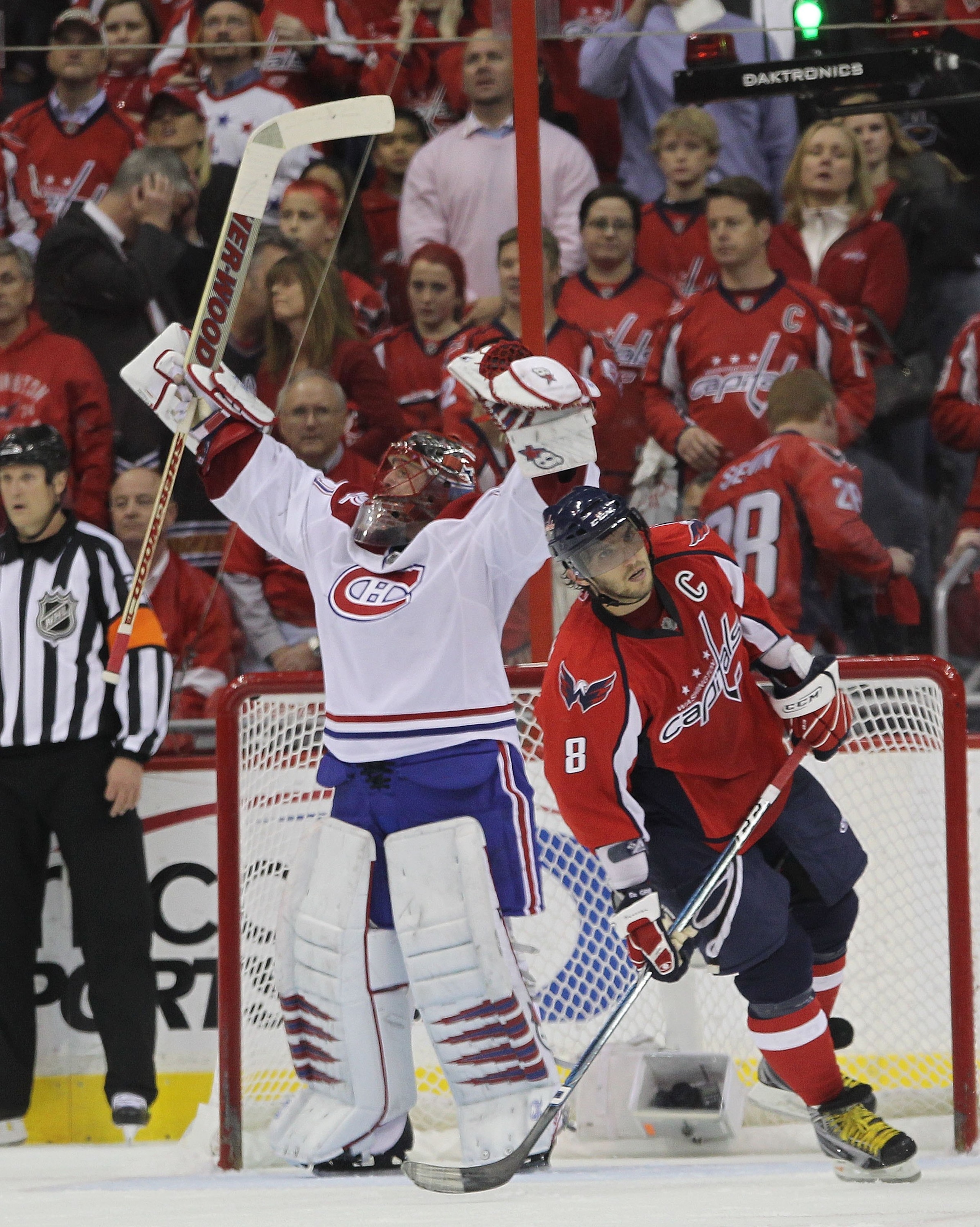 WASHINGTON - APRIL 28: Jaroslav Halak #41 of the Montreal Canadiens celebrates as Alex Ovechkin #8 of the Washington Capitals skates away following the Canadiens 2-1 win in Game Seven of the Eastern Conference Quarterfinals during the 2010 NHL Stanley Cup