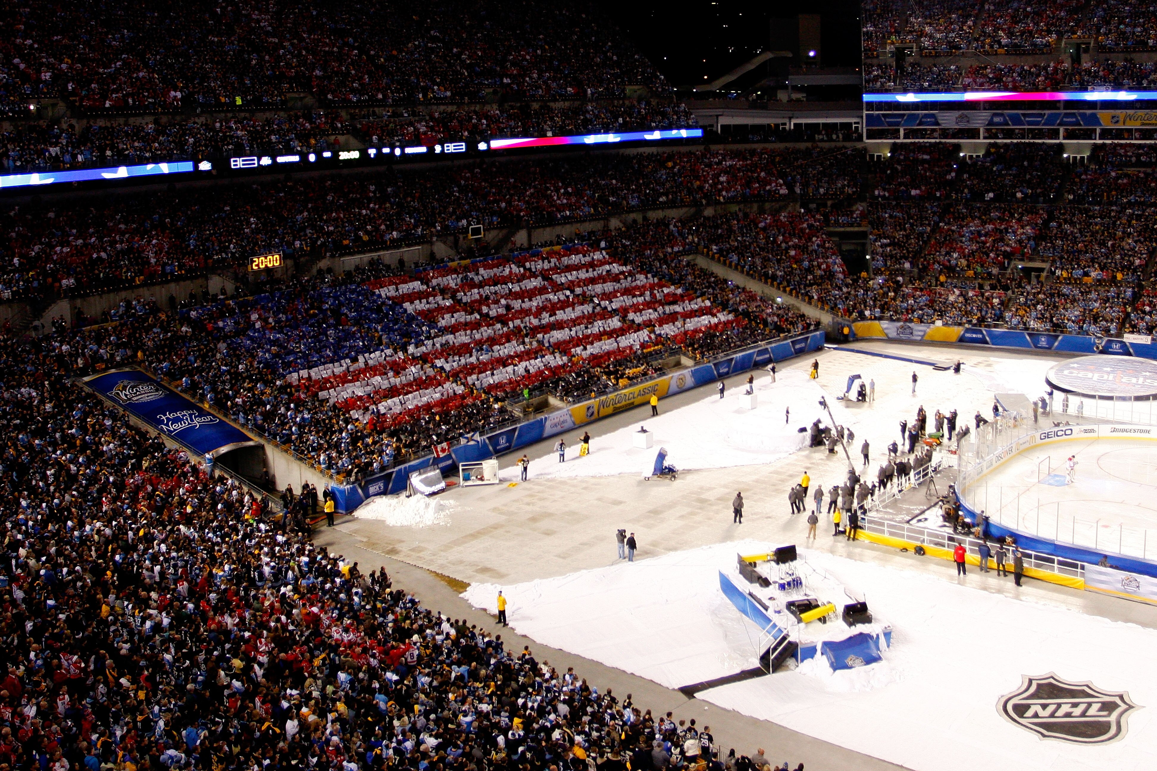 PITTSBURGH, PA - JANUARY 01:  An American Flag is seen in the stands during the singing of the U.S. National Anthem before the start of the 2011 NHL Bridgestone Winter Classic at Heinz Field on January 1, 2011 in Pittsburgh, Pennsylvania.  (Photo by Justi
