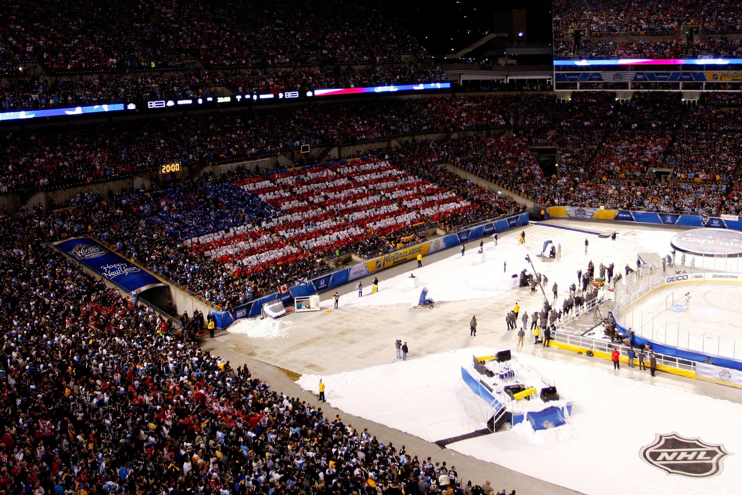 PITTSBURGH, PA - JANUARY 01:  An American Flag is seen in the stands during the singing of the U.S. National Anthem before the start of the 2011 NHL Bridgestone Winter Classic at Heinz Field on January 1, 2011 in Pittsburgh, Pennsylvania.  (Photo by Justi