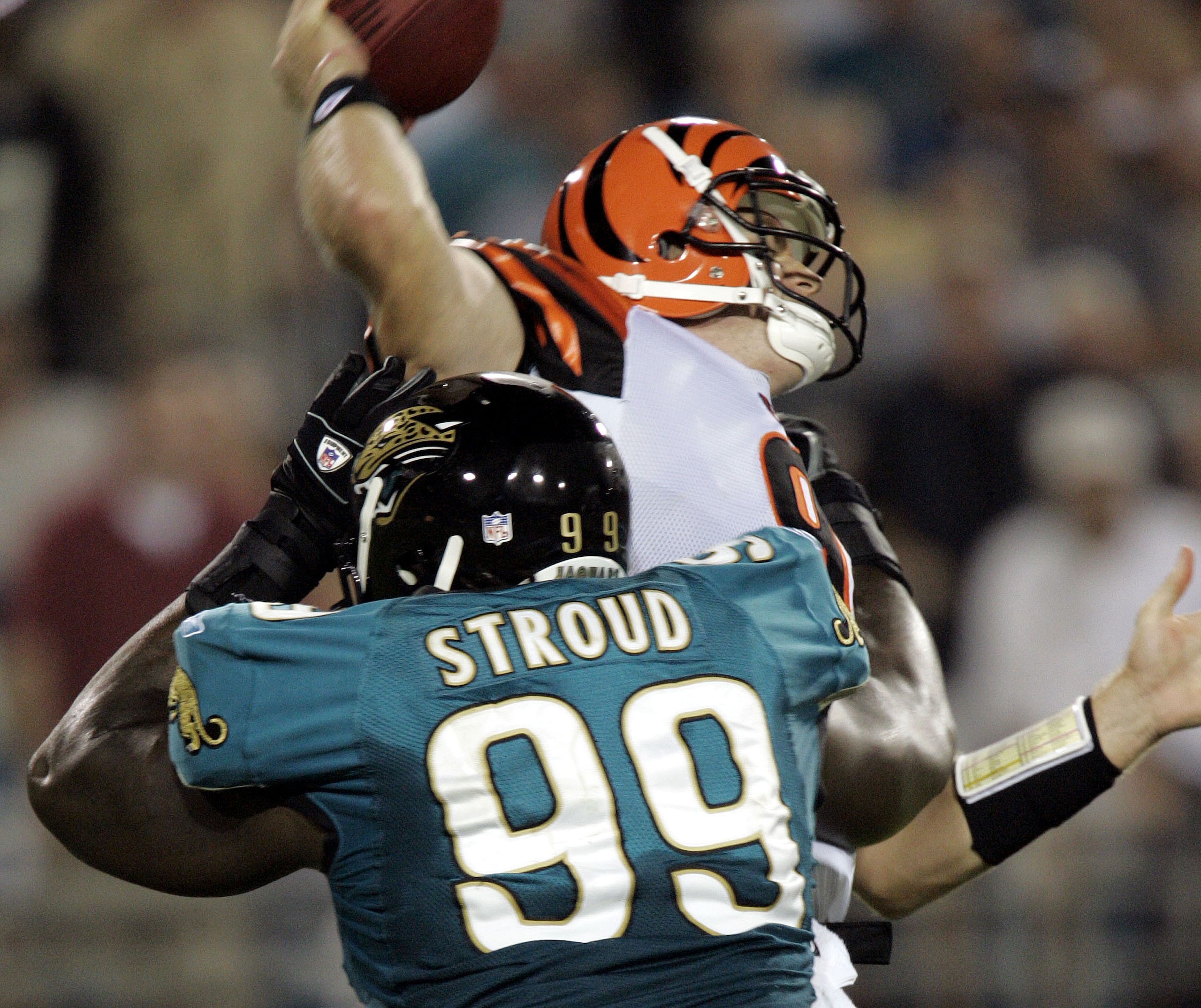 JACKSONVILLE, FL - OCTOBER 9:  Quarterback Carson Palmer #9 of the Cincinnati Bengals is sacked by defensive tackle Marcus Stroud #99 of the Jacksonville Jaguars in the first quarter October 9, 2005 at Alltel Stadium in Jacksonville, Florida.  (Photo by E