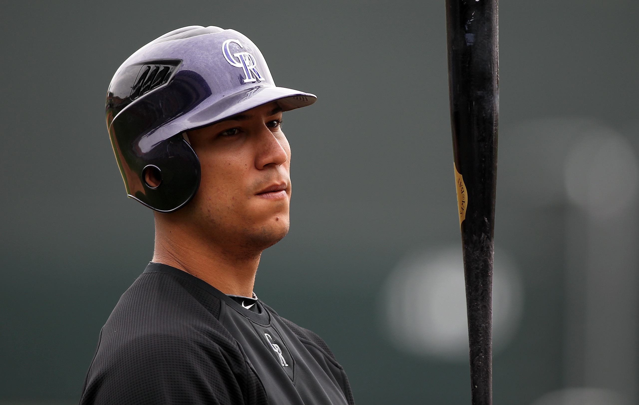 SCOTTSDALE, AZ - FEBRUARY 26:  Carlos Gonzalez #5 of the Colorado Rockies watches batting practice before the game against the Arizona Diamondbacks at Salt River Fields on February 26, 2011in Scottsdale, Arizona..  (Photo by Jonathan Ferrey/Getty Images)