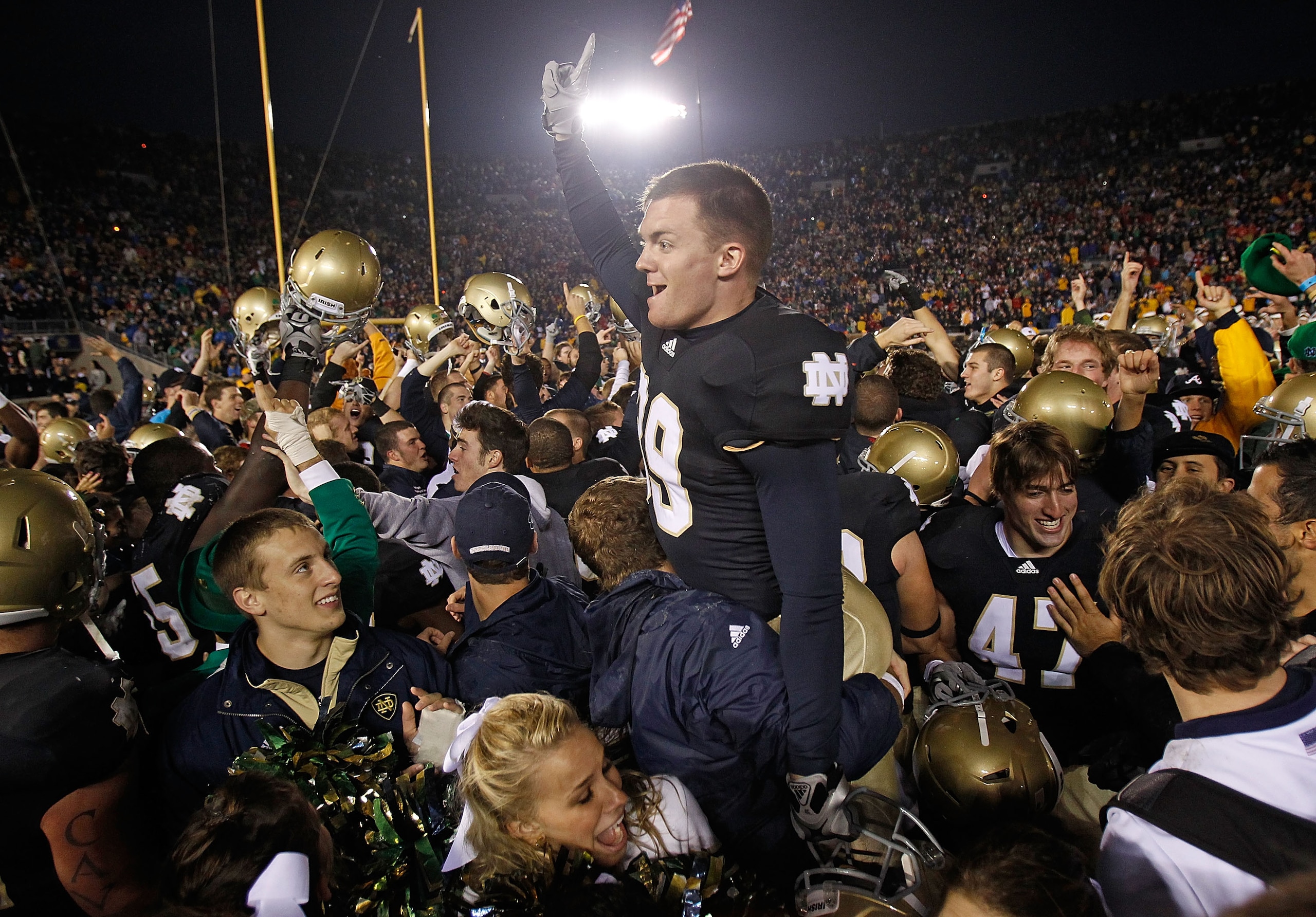 SOUTH BEND, IN - NOVEMBER 13: Ryan Sheehan #39 of the Notre Dame Fighting Irish is lifted by students while celebrating a win over the Utah Utes at Notre Dame Stadium on November 13, 2010 in South Bend, Indiana. Notre Dame defeated Utah 28-3. (Photo by Jo SOUTH BEND, IN - NOVEMBER 13: Ryan Sheehan #39 of the Notre Dame Fighting Irish is lifted by students while celebrating a win over the Utah Utes at Notre Dame Stadium on November 13, 2010 in South Bend, Indiana. Notre Dame defeated Utah 28-3. (Photo by Jo