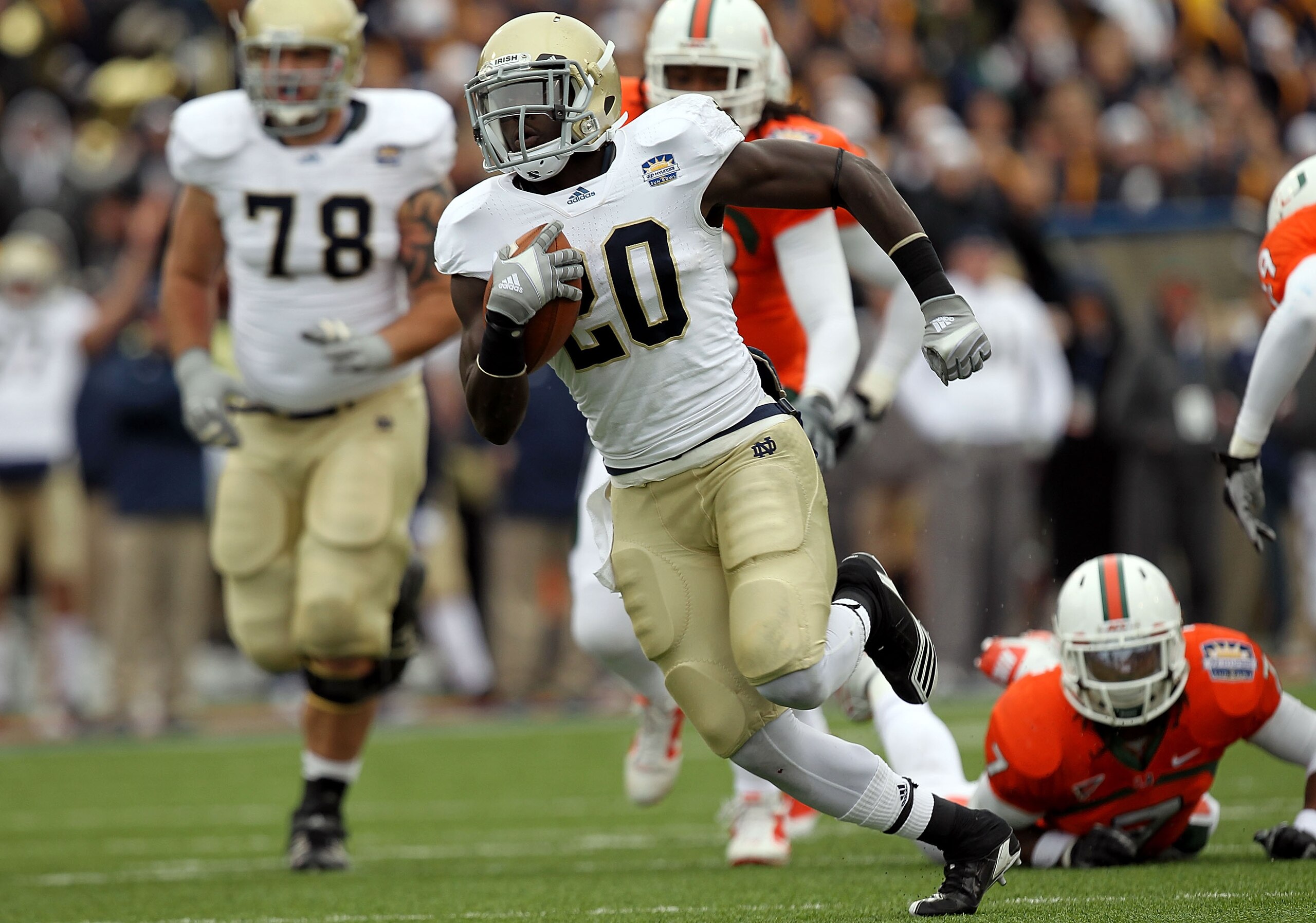 EL PASO, TX - DECEMBER 30: Running back Cierre Wood #20 of the Notre Dame Fighting Irish runs for a touchdown against the Miami Hurricanes during the Hyundai Sun Bowl at Sun Bowl on December 30, 2010 in El Paso, Texas. (Photo by Ronald Martinez/Getty Im EL PASO, TX - DECEMBER 30: Running back Cierre Wood #20 of the Notre Dame Fighting Irish runs for a touchdown against the Miami Hurricanes during the Hyundai Sun Bowl at Sun Bowl on December 30, 2010 in El Paso, Texas. (Photo by Ronald Martinez/Getty Im